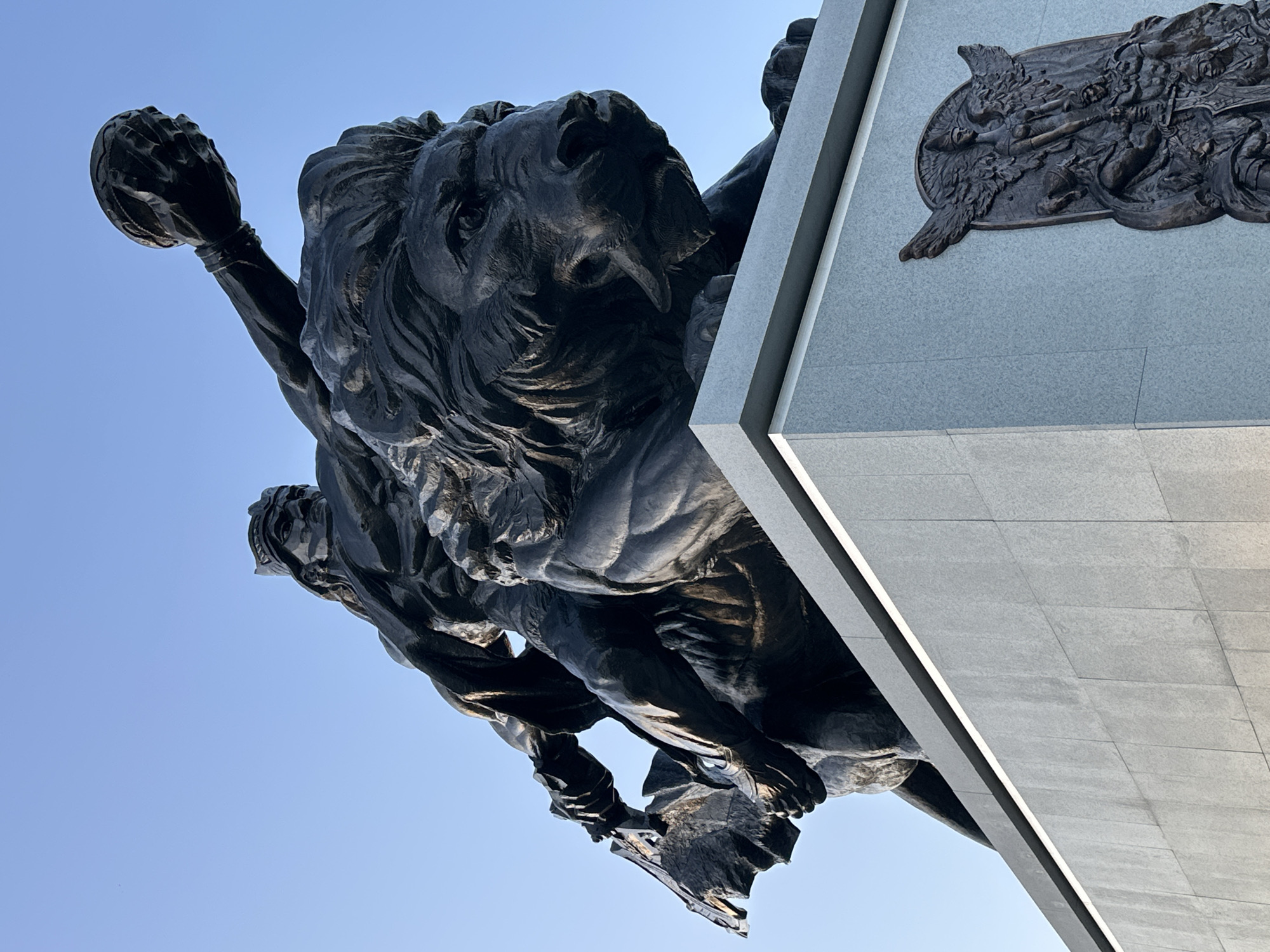 Observer documents statues, pinecones, and public art during afternoon walk