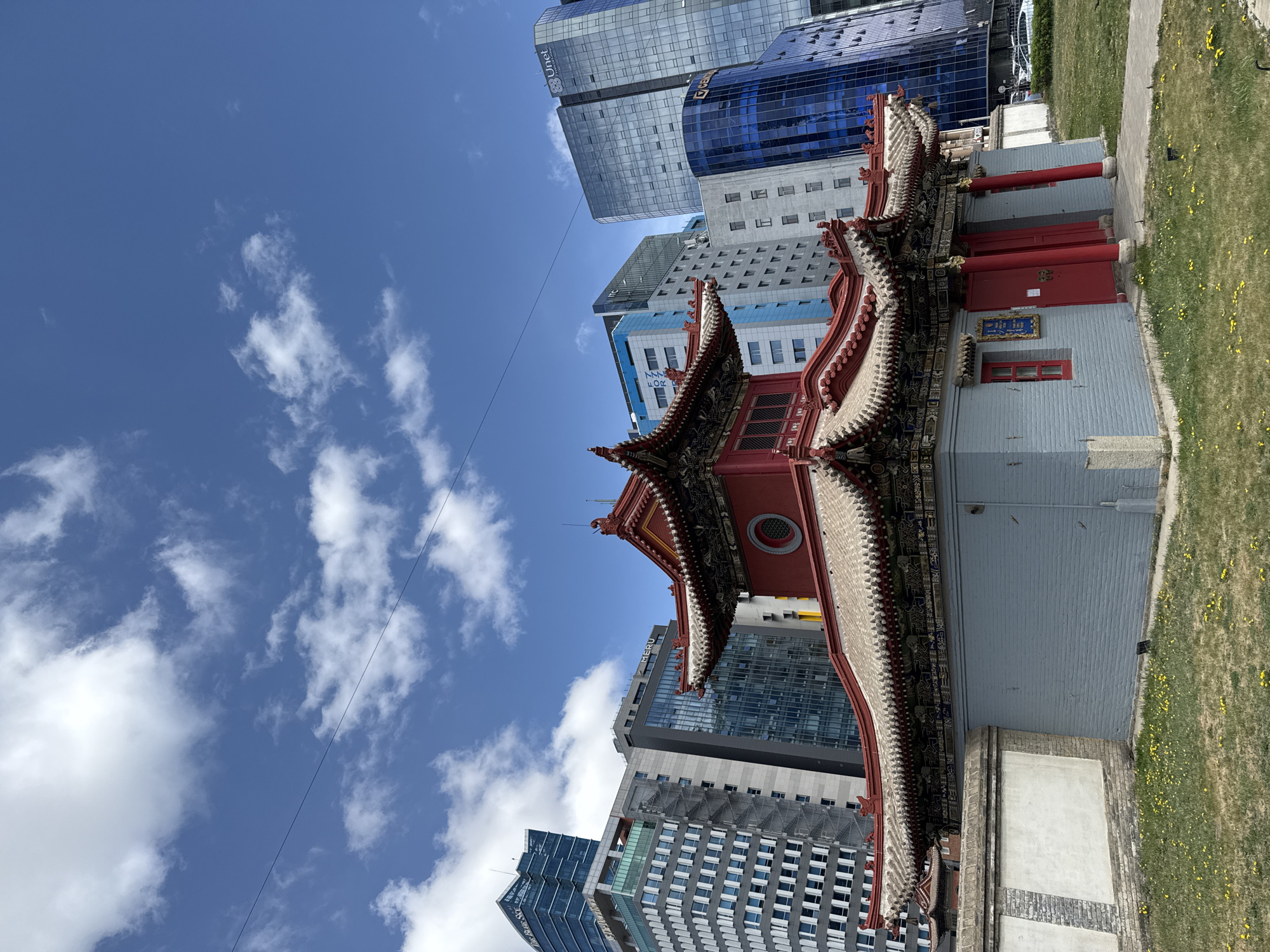 Traditional monastery documented amid modern Ulaanbaatar skyline