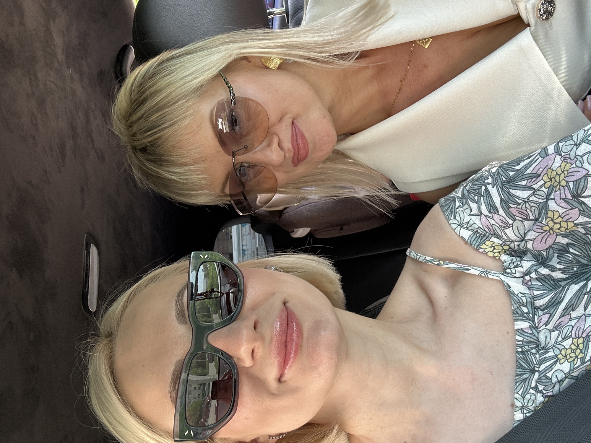 Women Take Selfies in Car with Children in Pushkino