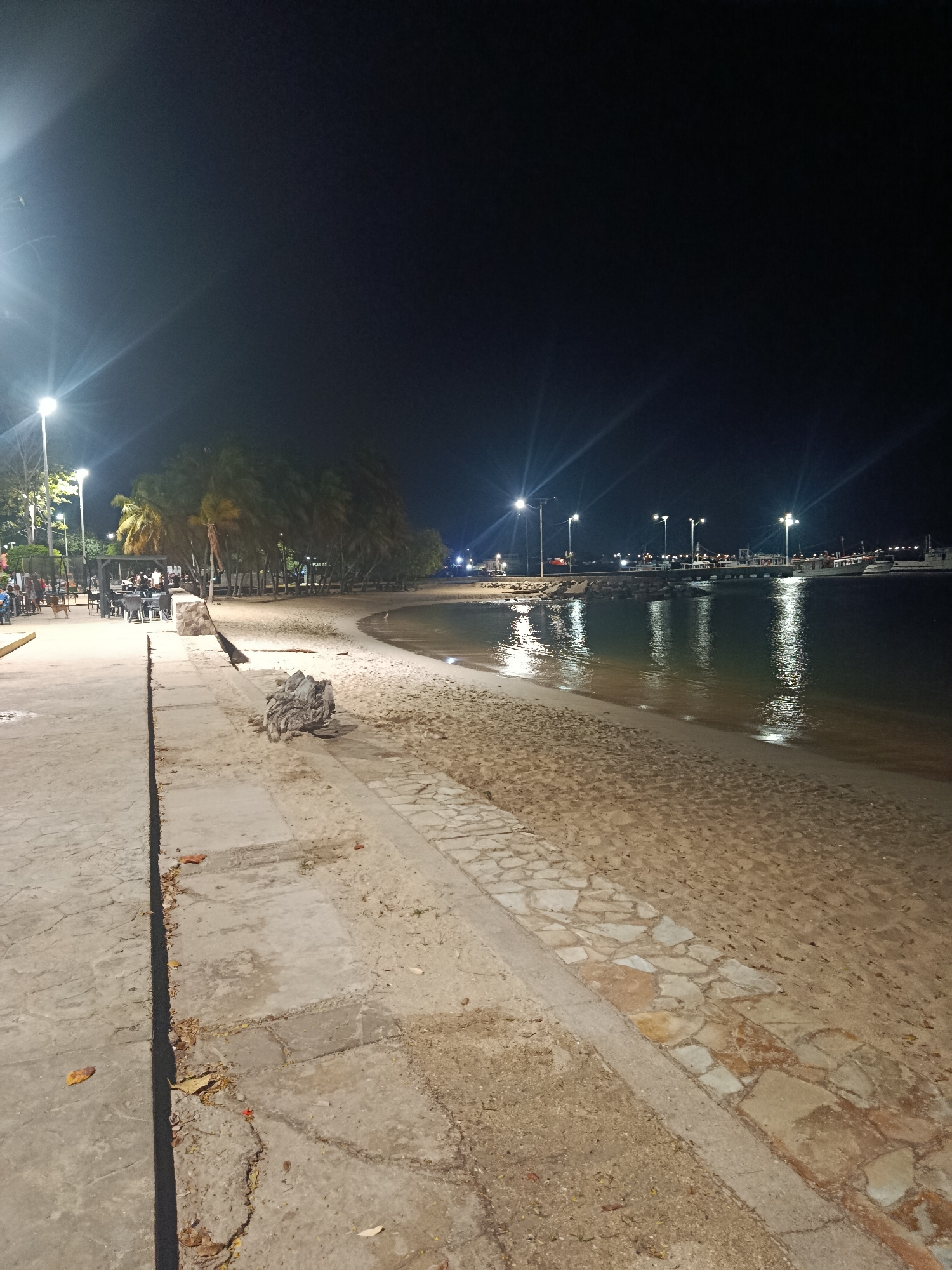 Nighttime stroll captured along Juan Griego waterfront promenade