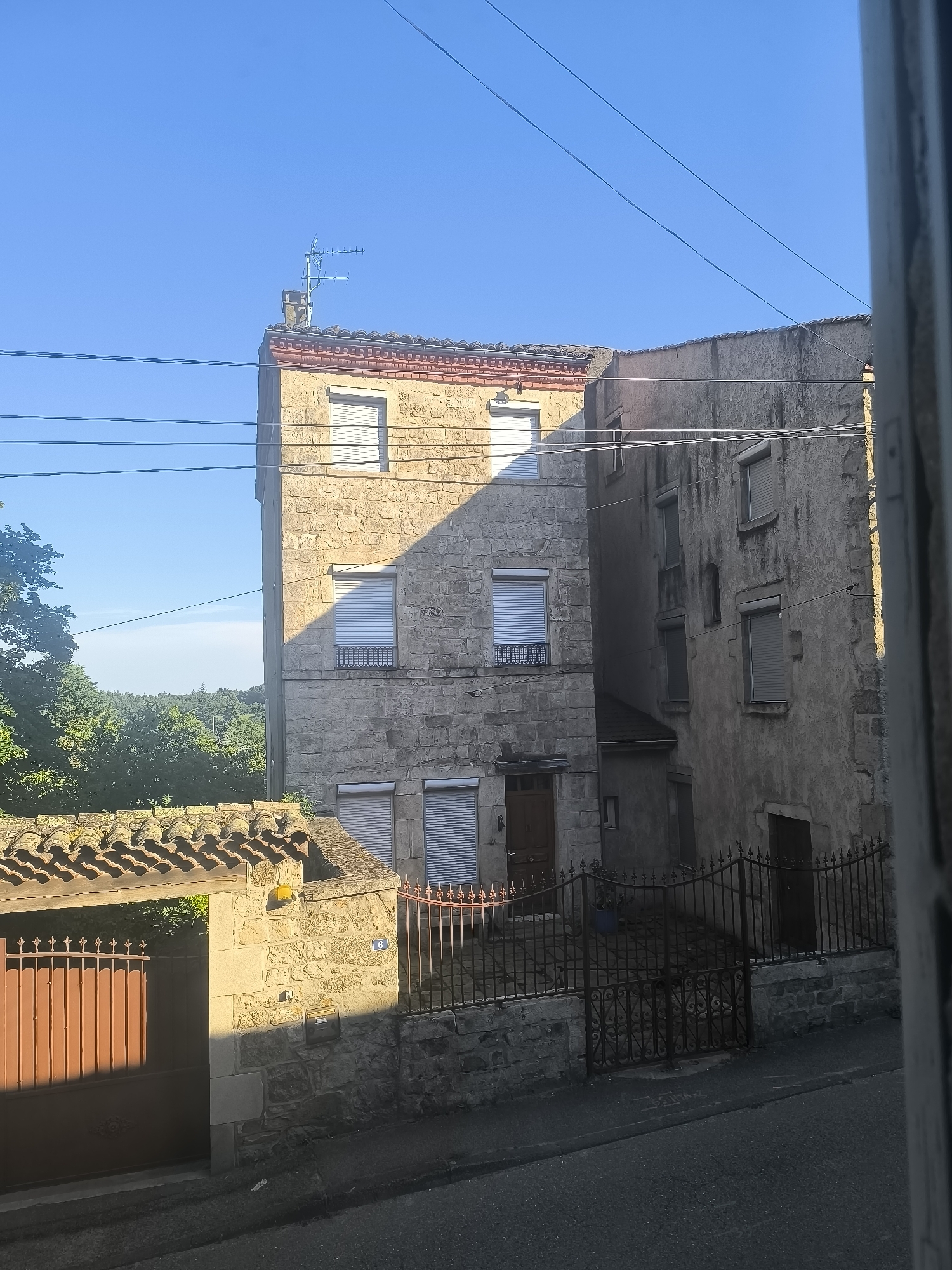 Street scene documented in Pélussin, France shows stone buildings