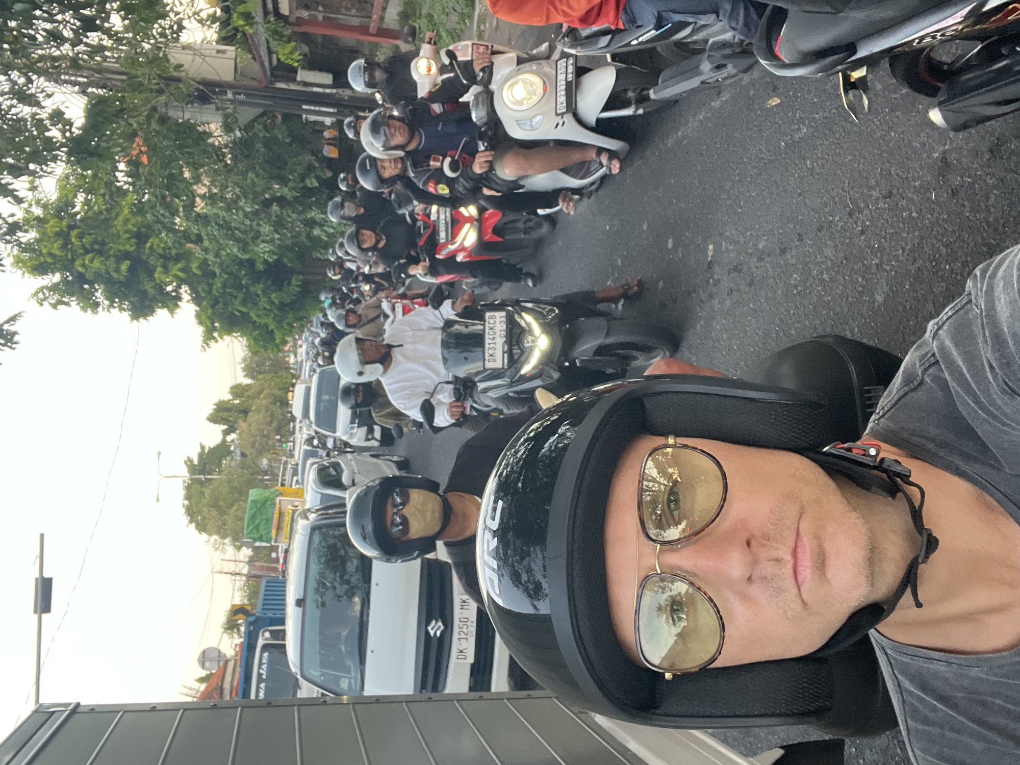 Motorbike ride through Denpasar traffic, temples, and street life