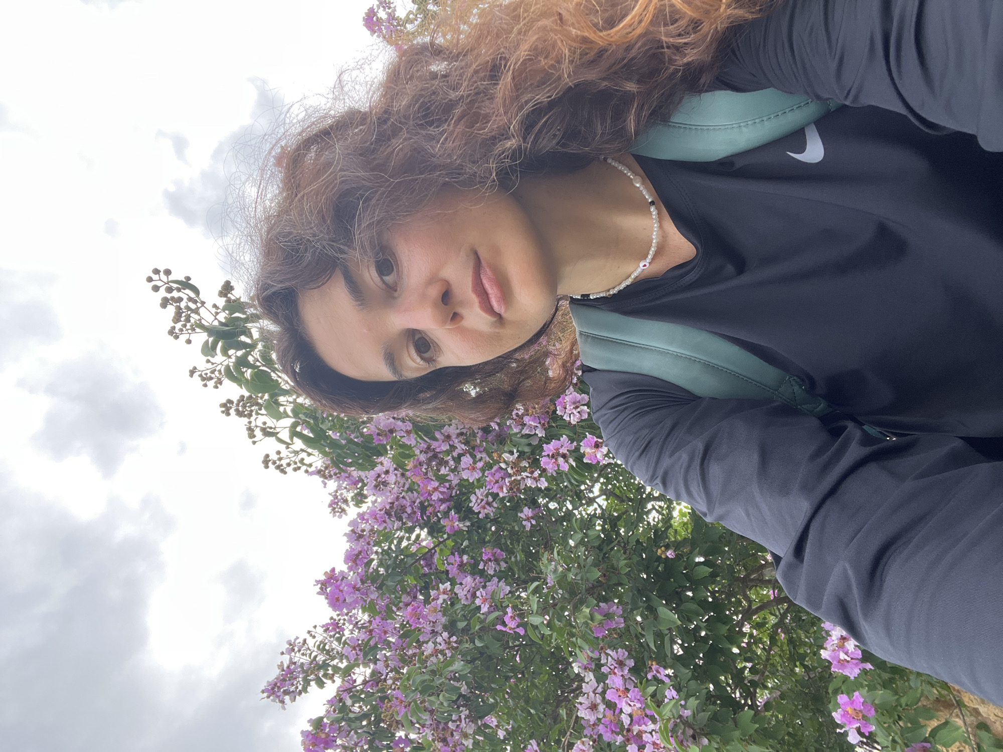 Roadside selfie stop among flowering plants in Phu Thuy Ward