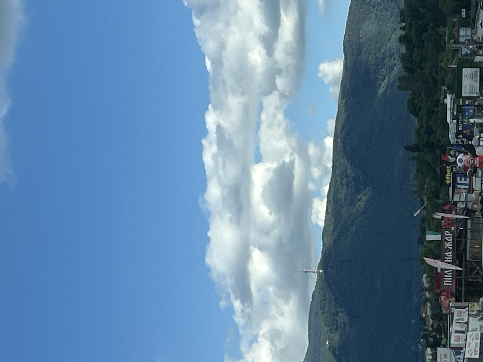 Highway drive through mountainous landscape with dramatic skies