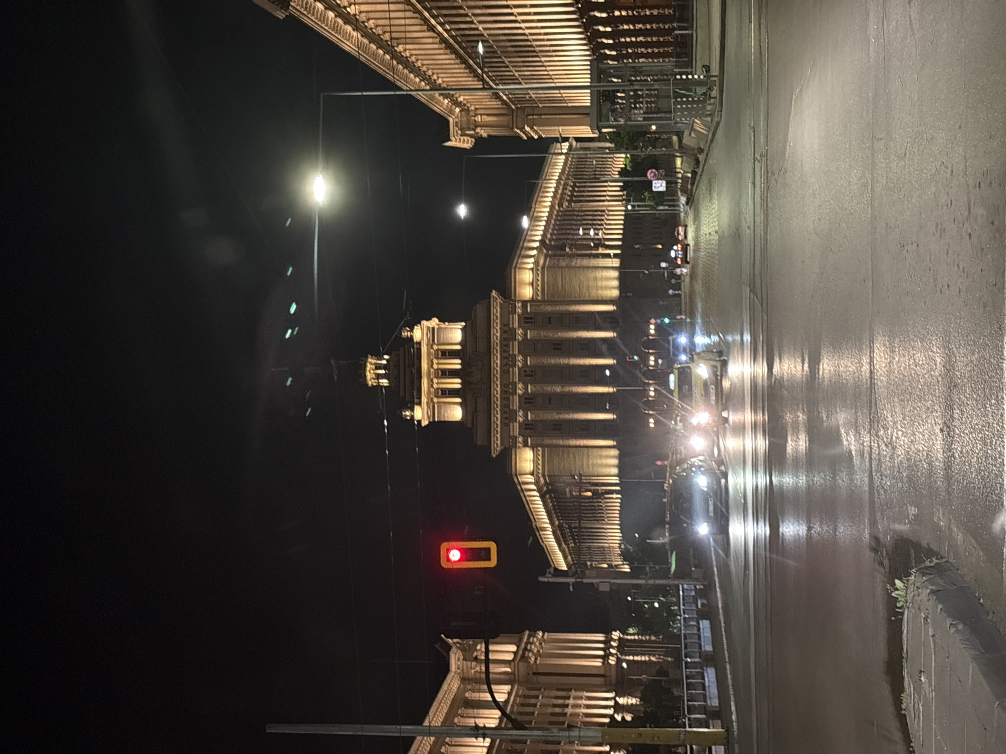 Sofia landmarks illuminated during wet evening hours