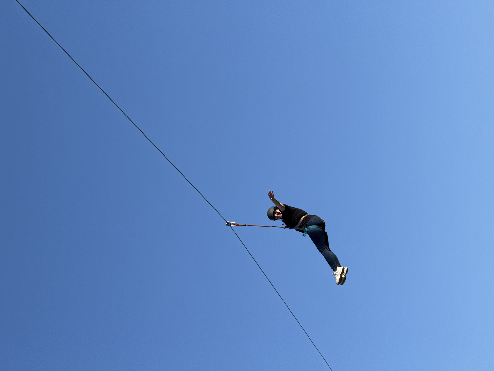 Ziplines and inflatables at an outdoor activity park