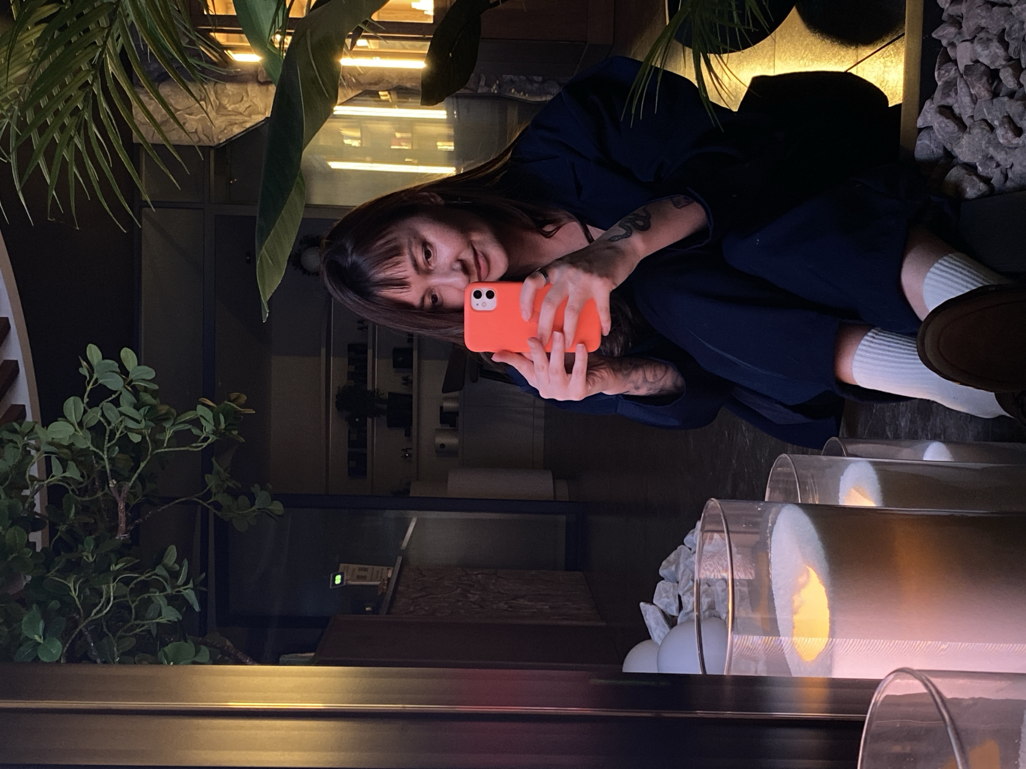 Woman takes selfies at Votkinsk restaurant during afternoon visit