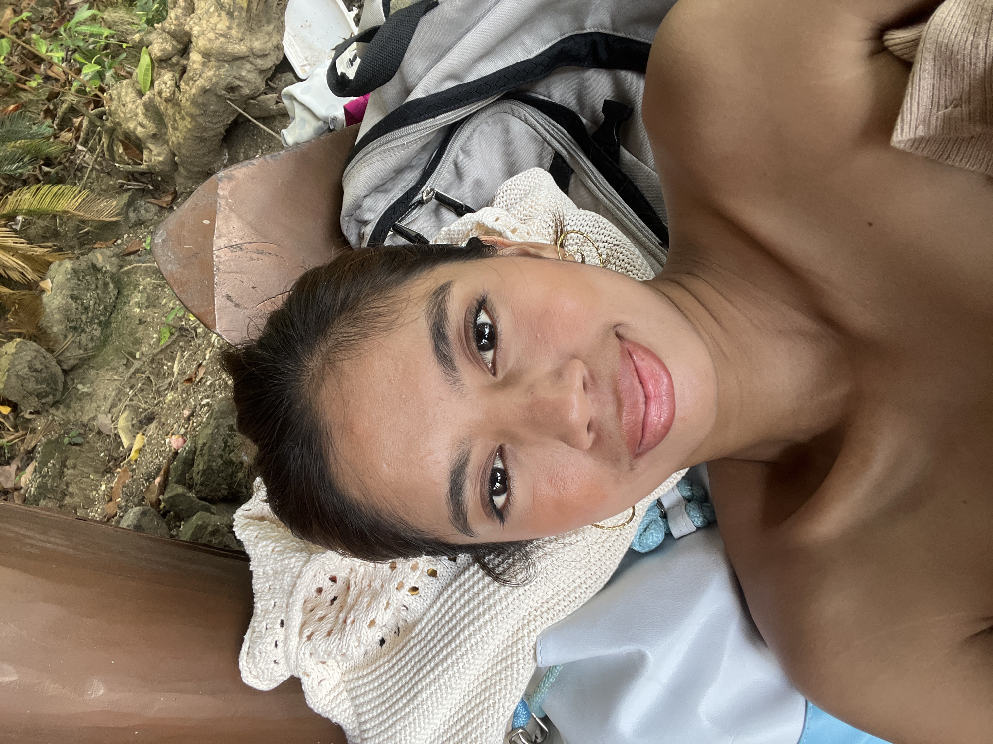Woman rests, takes selfies at Banaybanay beach early morning