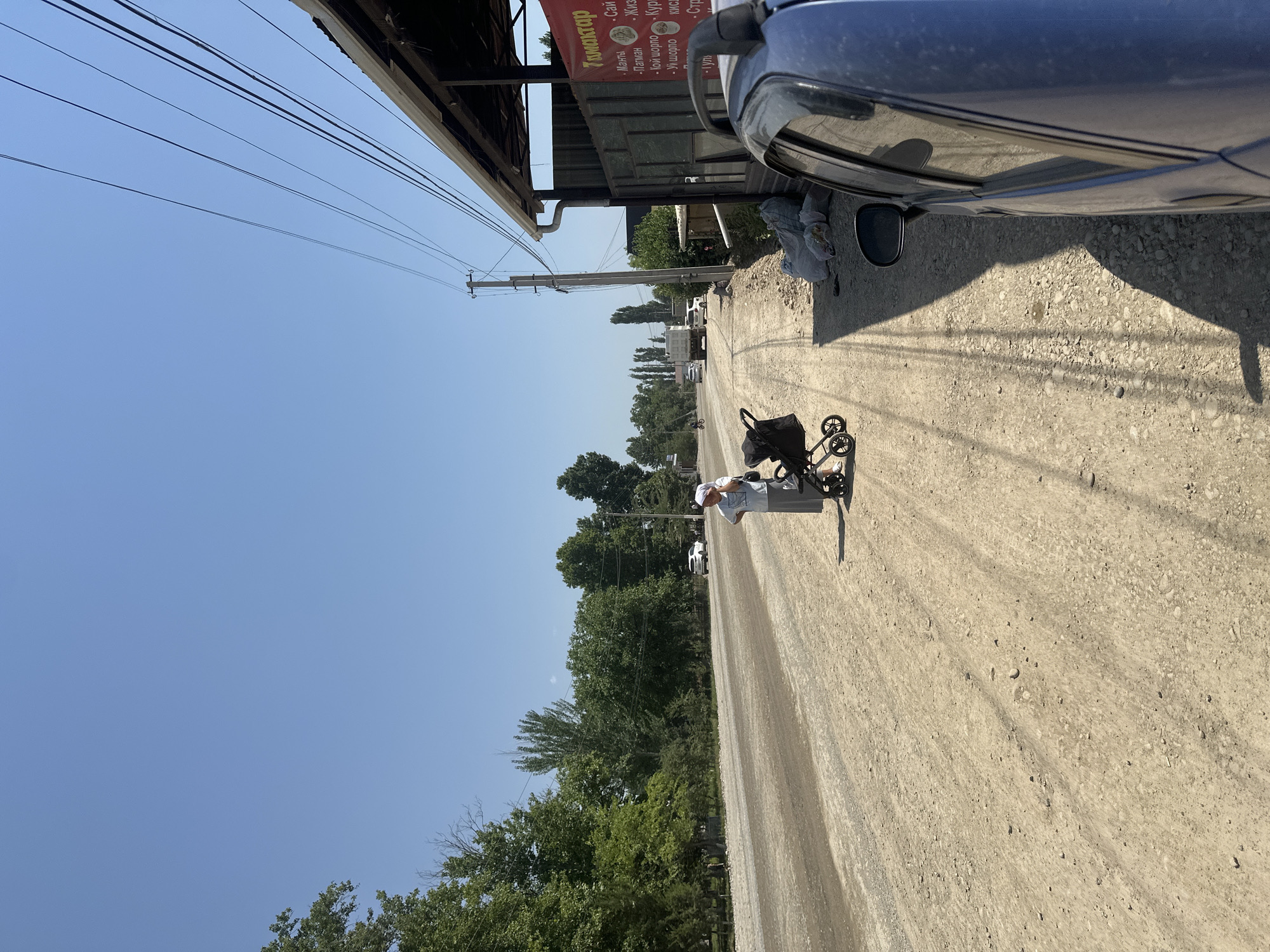 Quiet morning street life in a small Kyrgyz town
