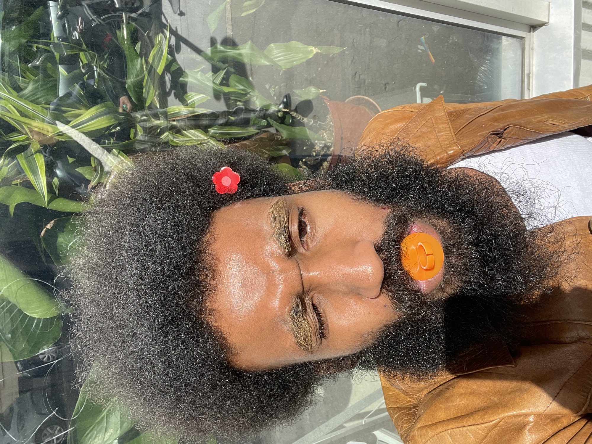 Portrait captured in Paris shows person with flower accessory