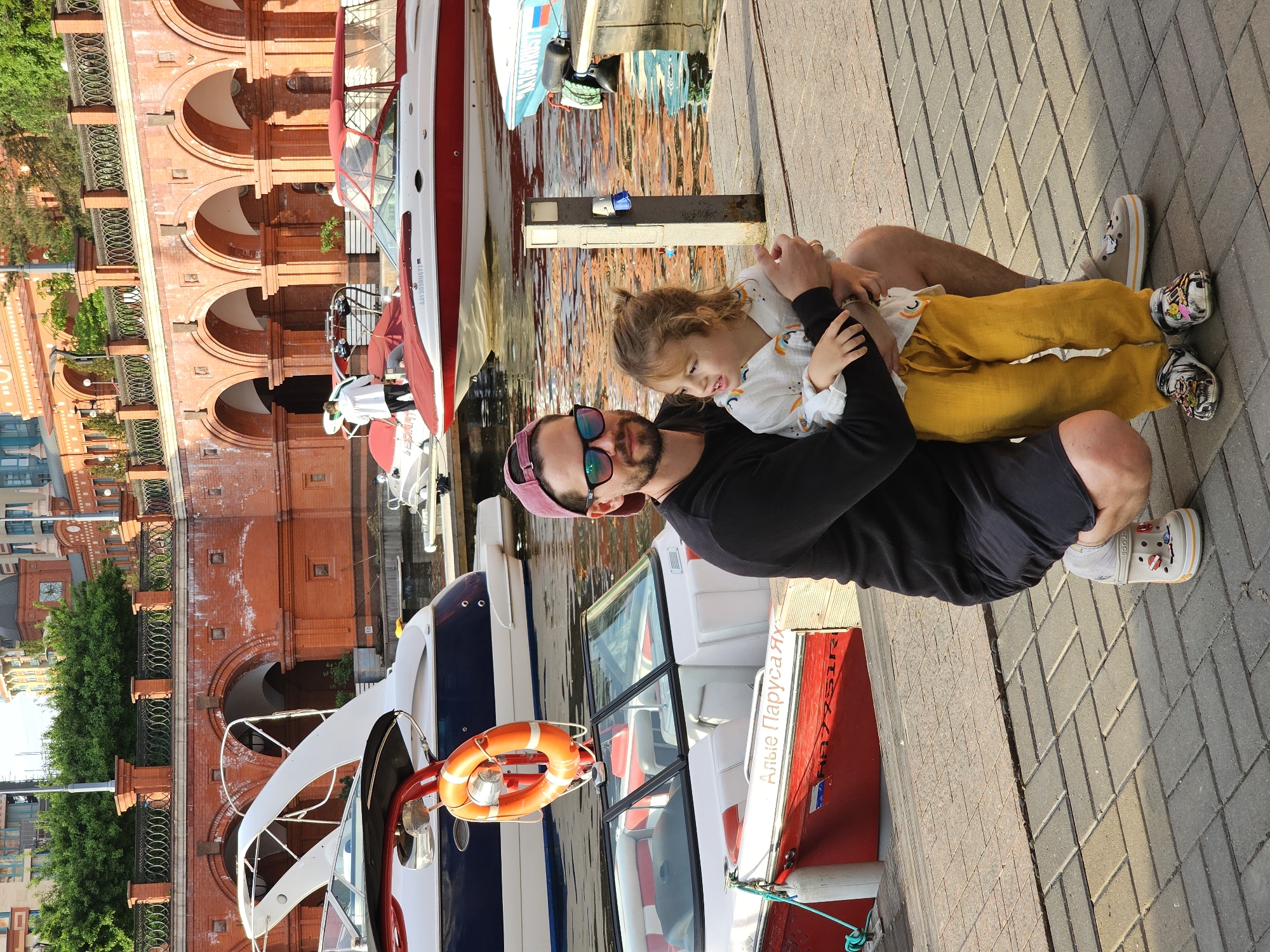 Man and child enjoy waterfront moment on Khimki pier