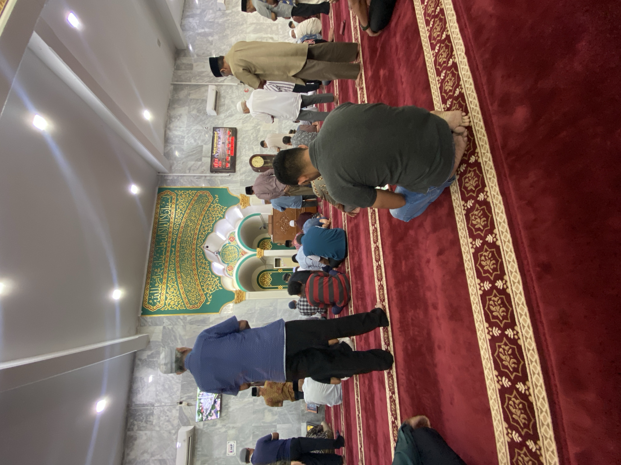 Morning congregation at prayer inside a Lhokseumawe mosque