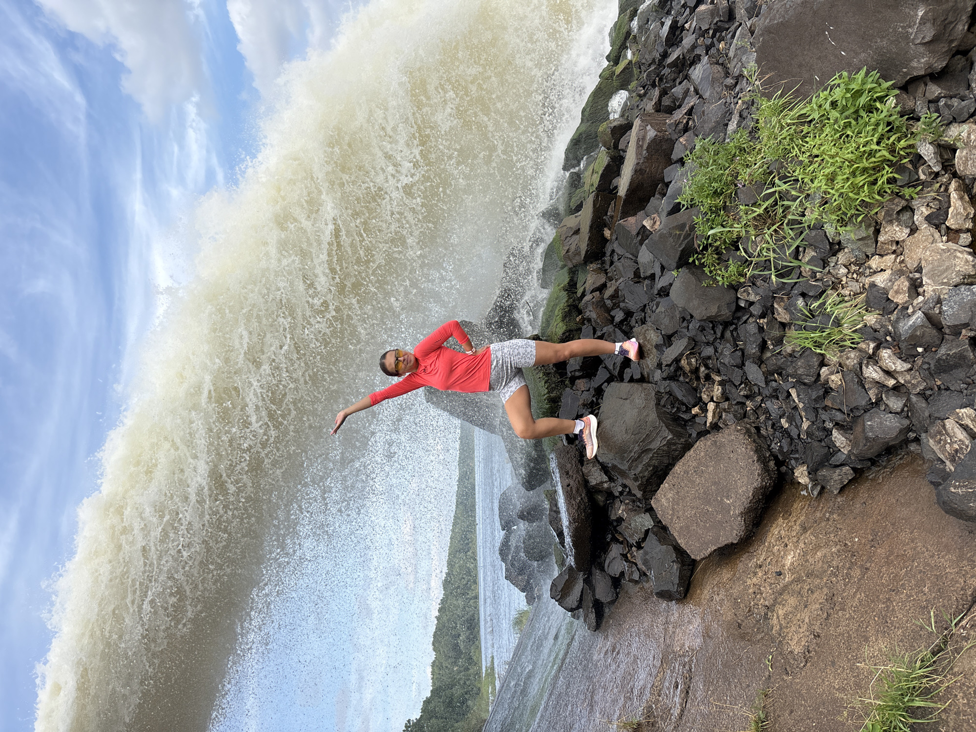 Brown water surges from concrete pipe at Chernushka waterfall site