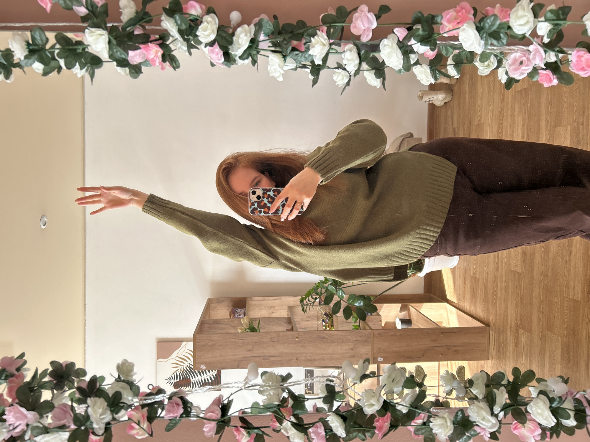 Woman takes multiple selfies in decorated room in Chaikovsky