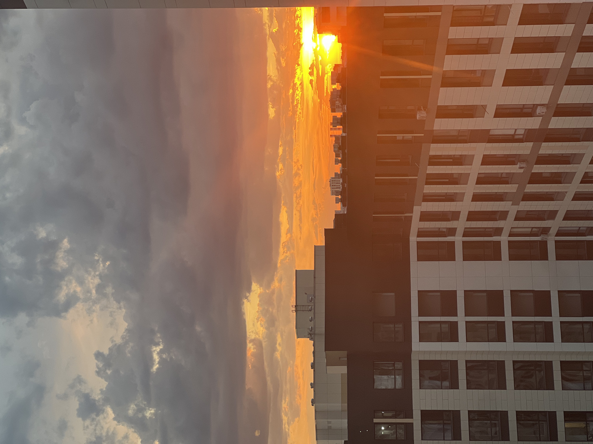 Dramatic sunset over Astana's residential skyline, June 2026