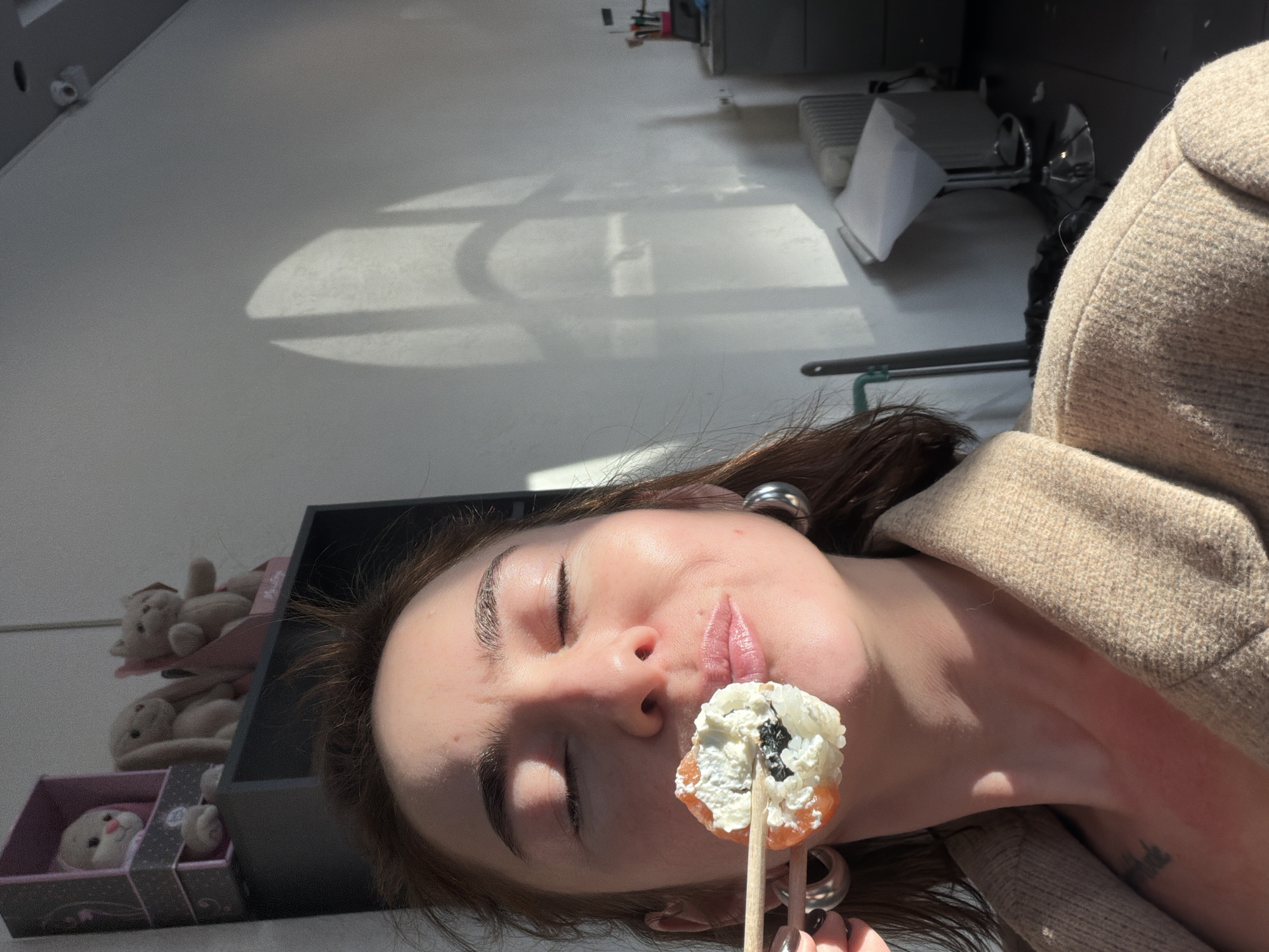 Woman enjoys sushi lunch in Ust-Ilimsk, Russia