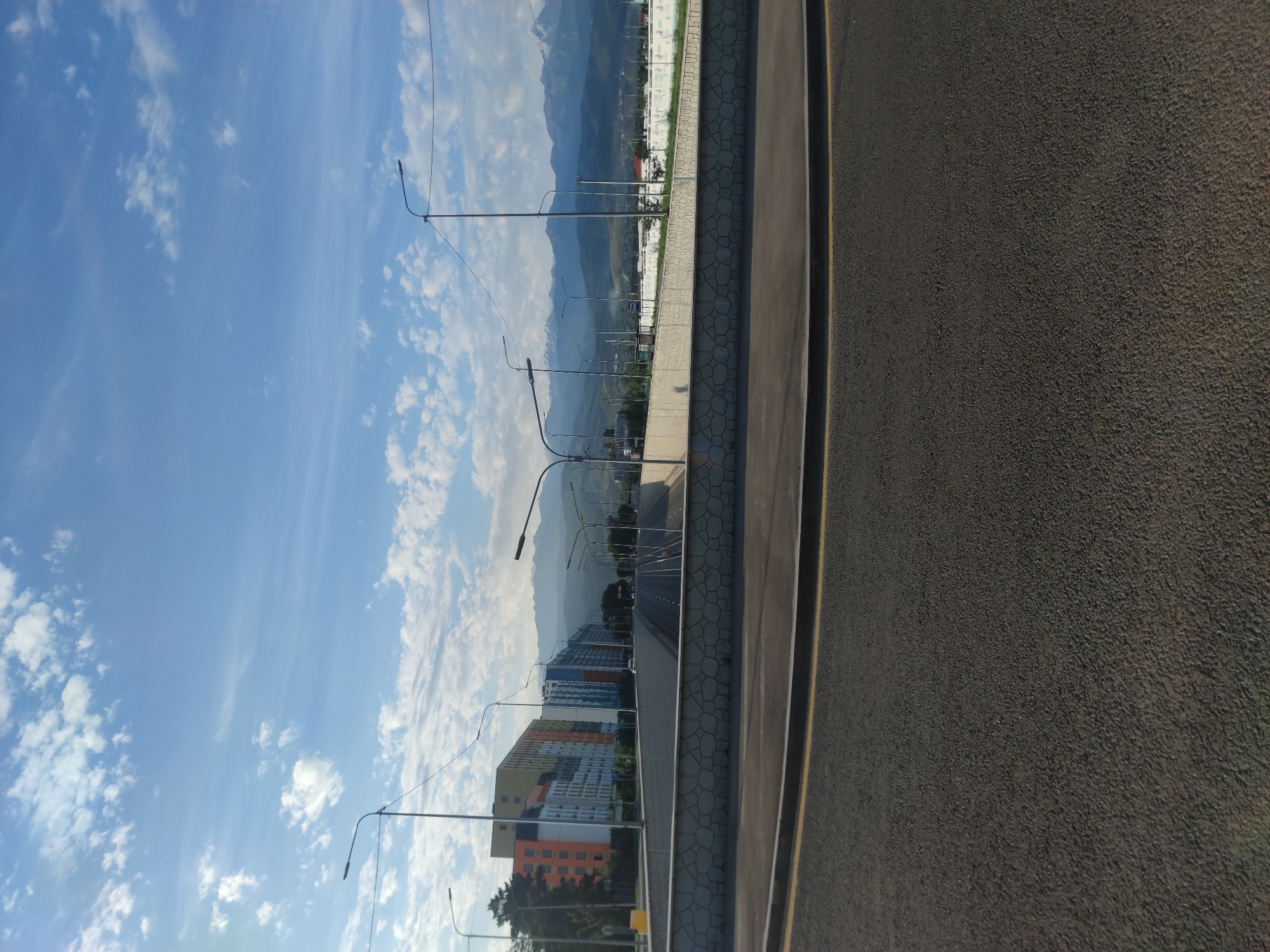 Almaty overpass district: city streets meet mountain backdrop