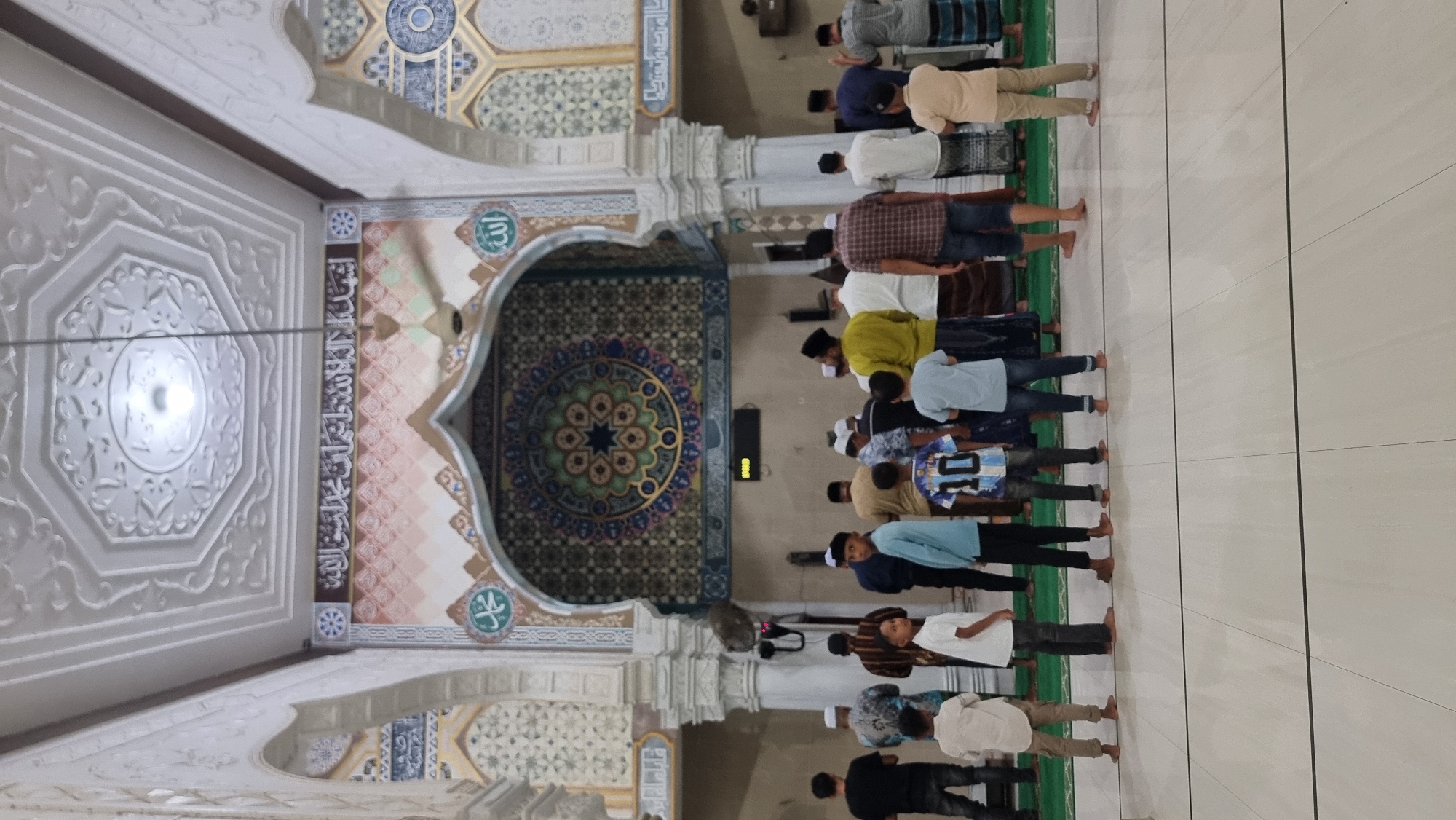 Midday prayers at an ornate mosque in Meunasahlhok, Indonesia