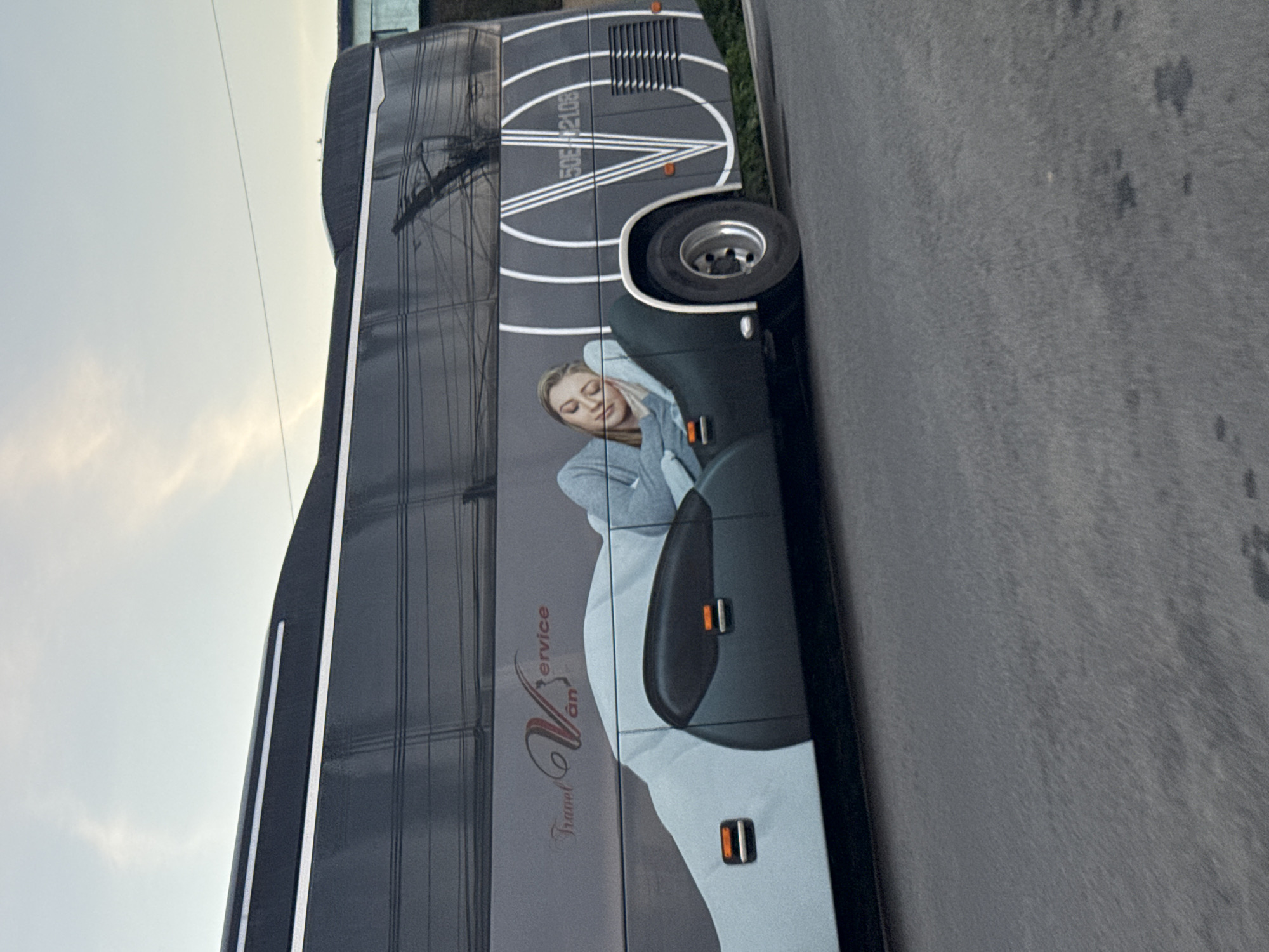 Evening scenes in Đà Lạt: a bus ad and a tea ceremony setup