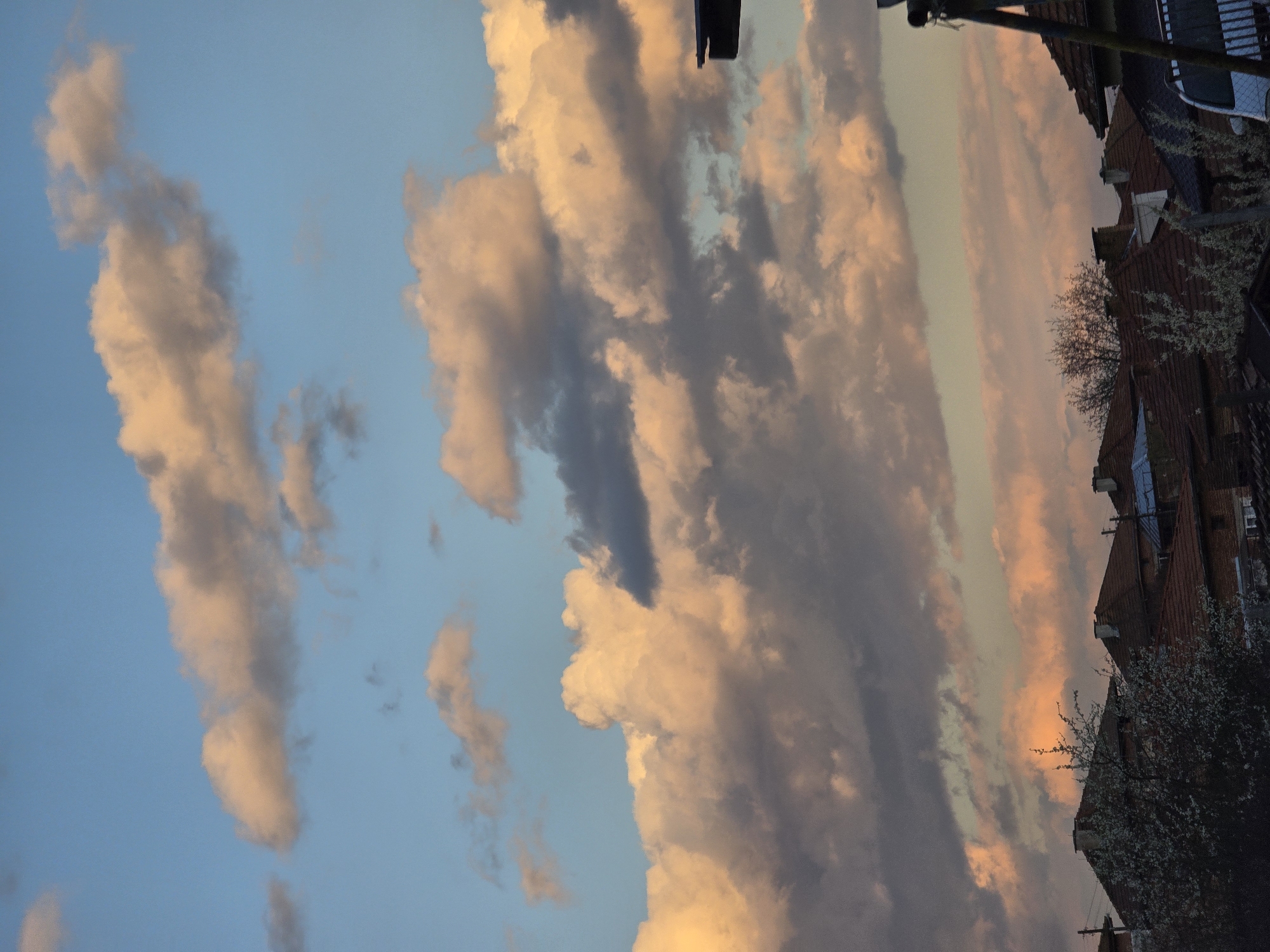 Sunset illuminates clouds over Bulgarian countryside near Borovo