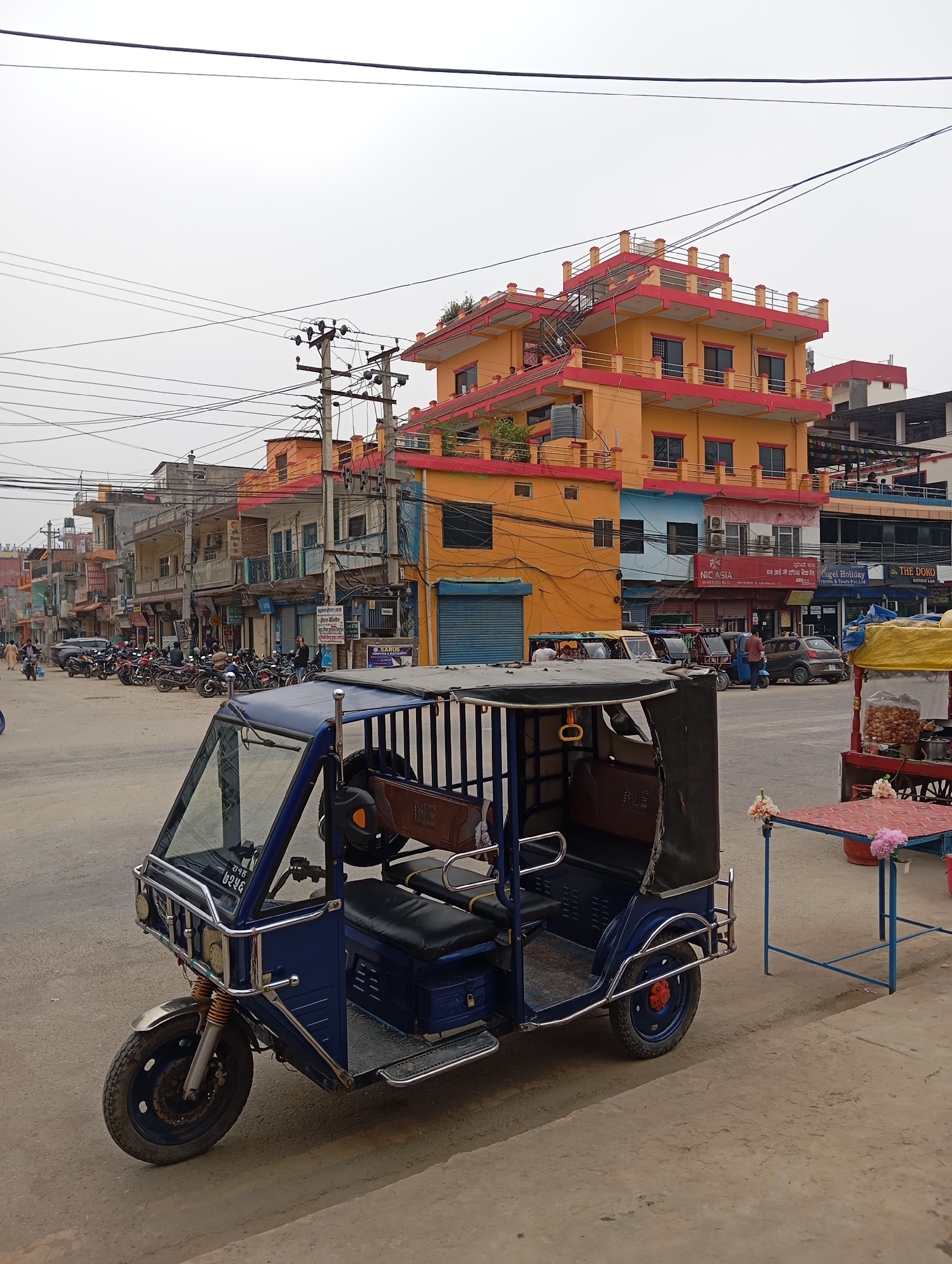 Electric rickshaw parked at Belahiya street intersection
