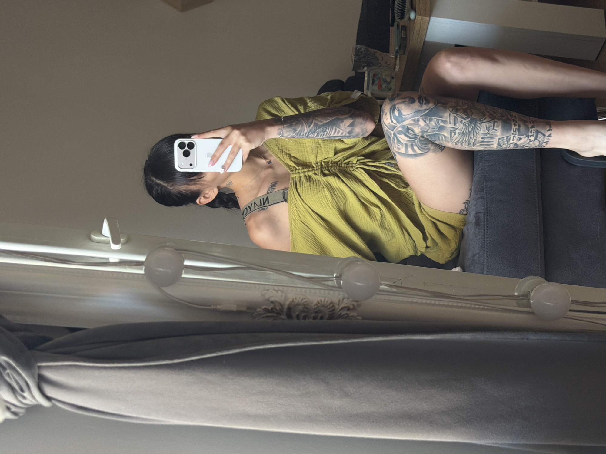 Tattooed woman conducts morning photo session in Plovdiv apartment