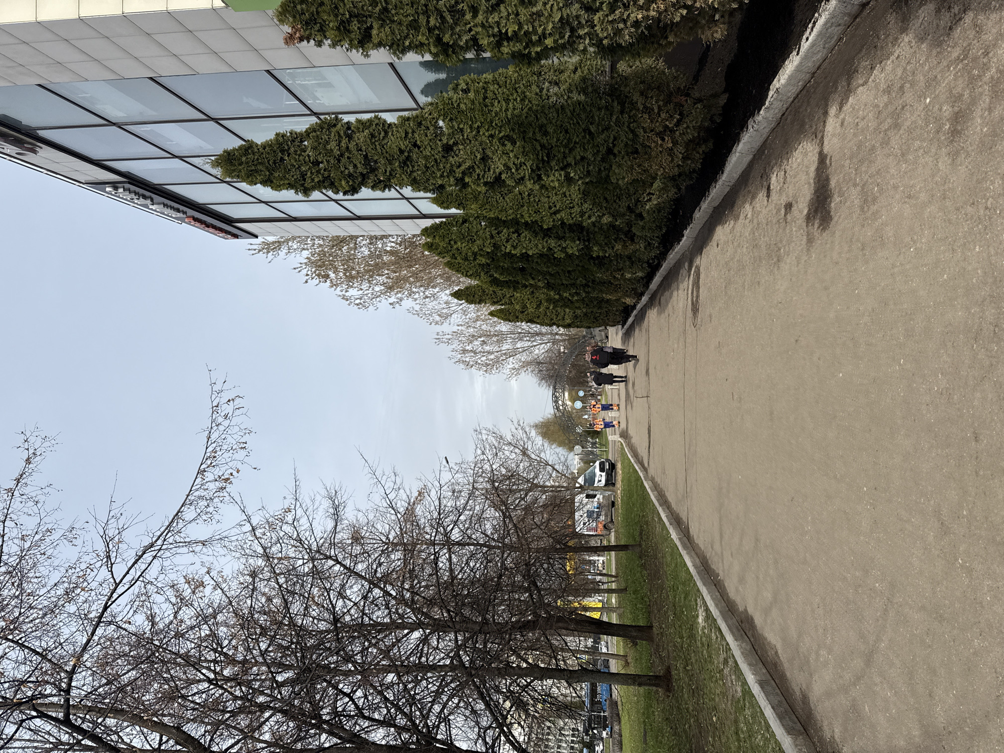 Woman photographed on Moscow sidewalk during morning walk