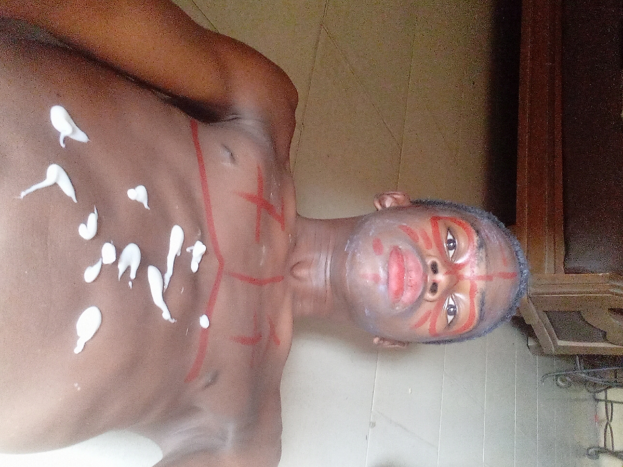 Traditional body painting ceremony documented in Onitsha, Nigeria
