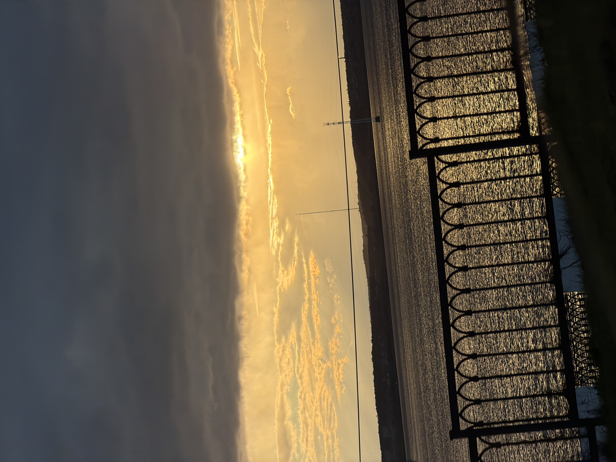 Golden sunset captured over water body in Izhevsk, Russia