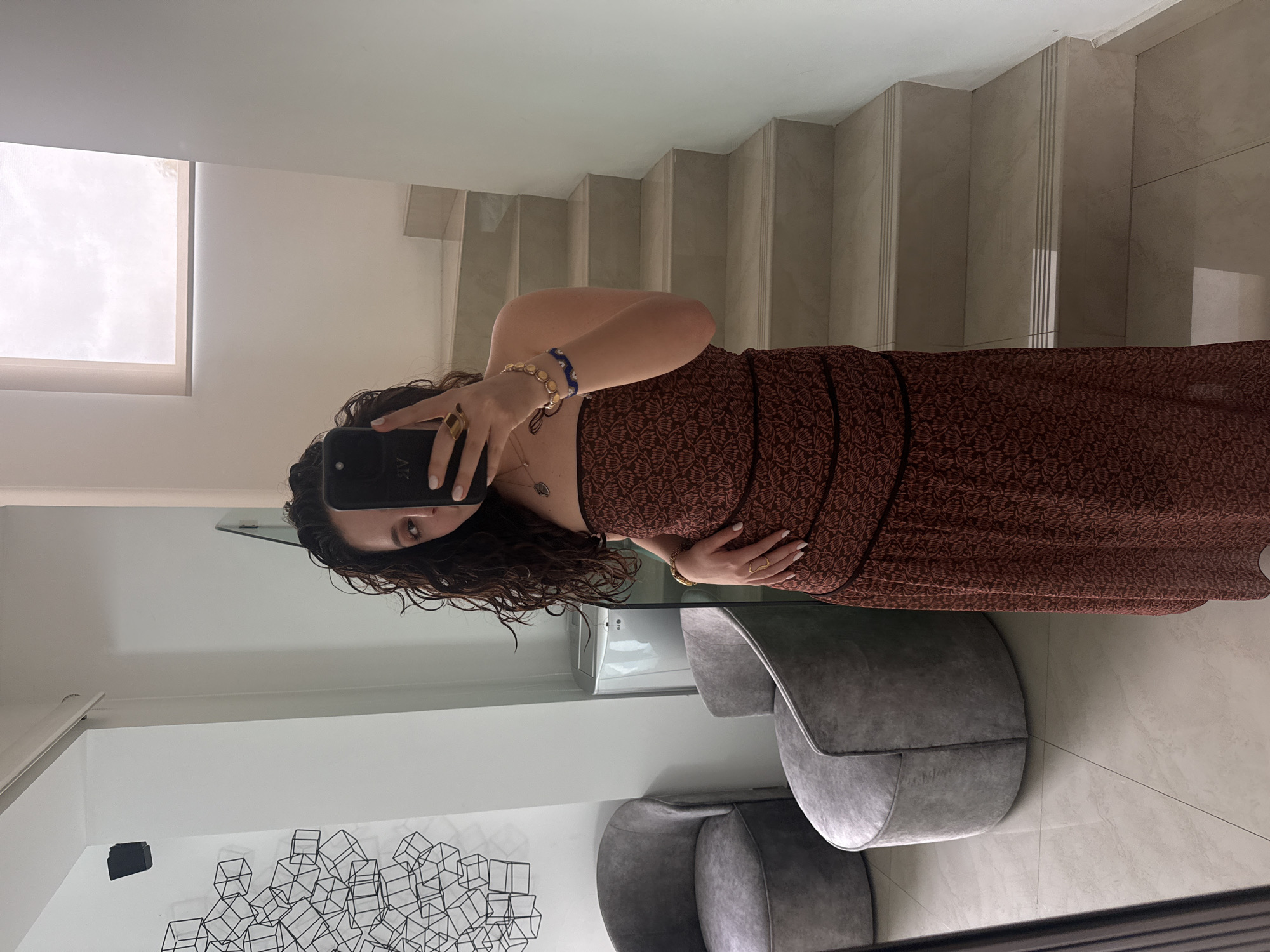 Mirror selfies in a modern Mexican interior, dressed up for the night