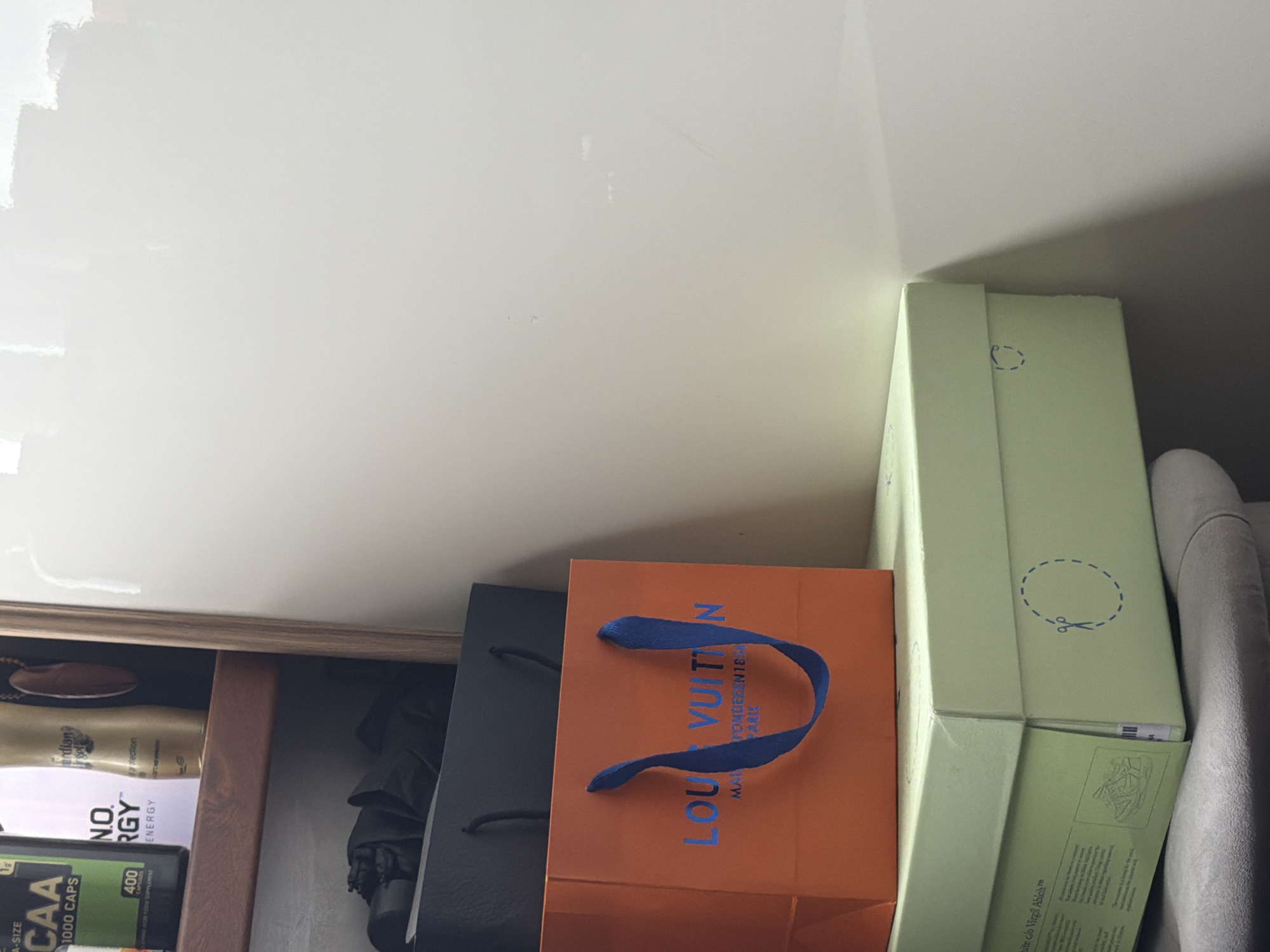 Dietary supplements and shopping bags documented on Sofia shelf