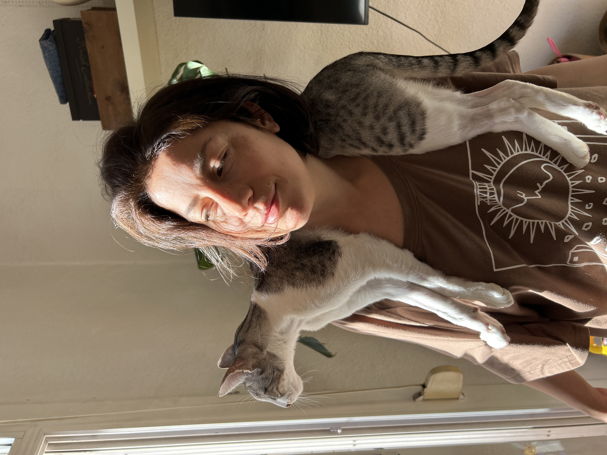 Woman enjoys quiet morning with cats in Barcelona home