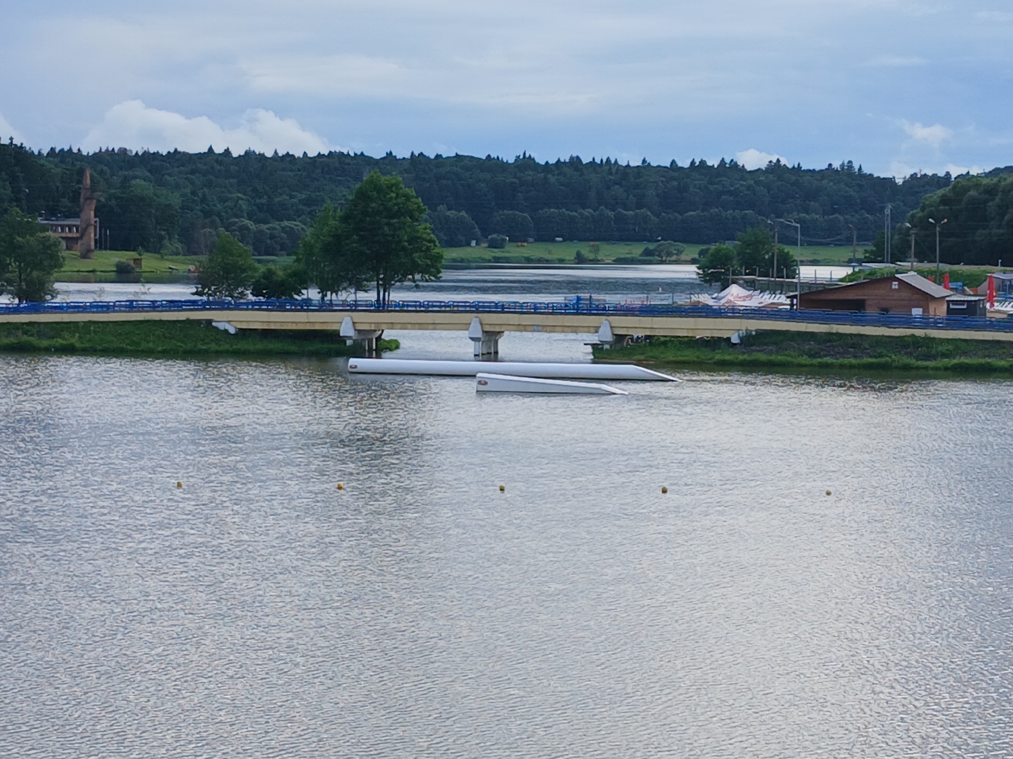 Quiet afternoon around a rural Belarusian riverbank and neighborhood