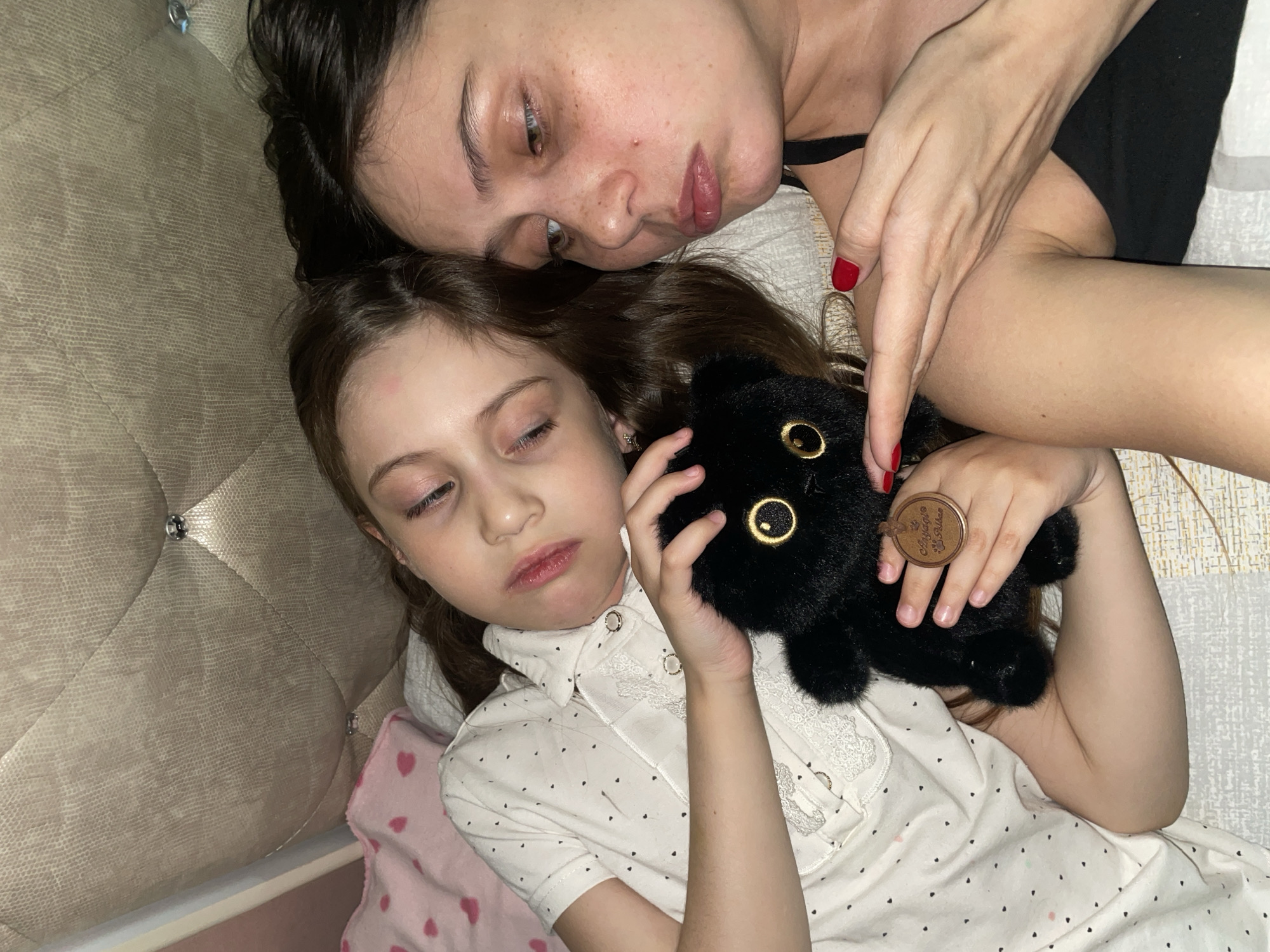 Mother and child share quiet bedtime moments in Izhevsk