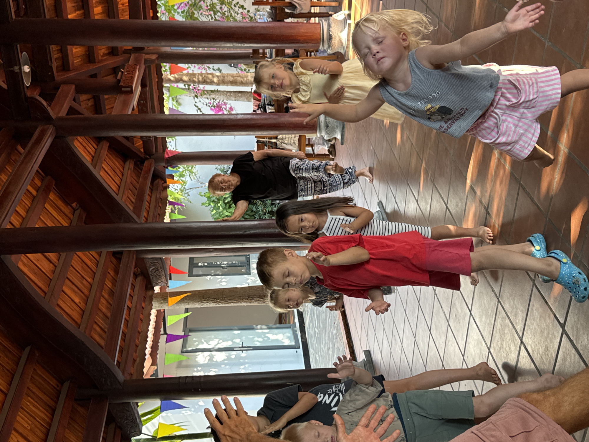 Children participate in group dance activities in Mũi Né