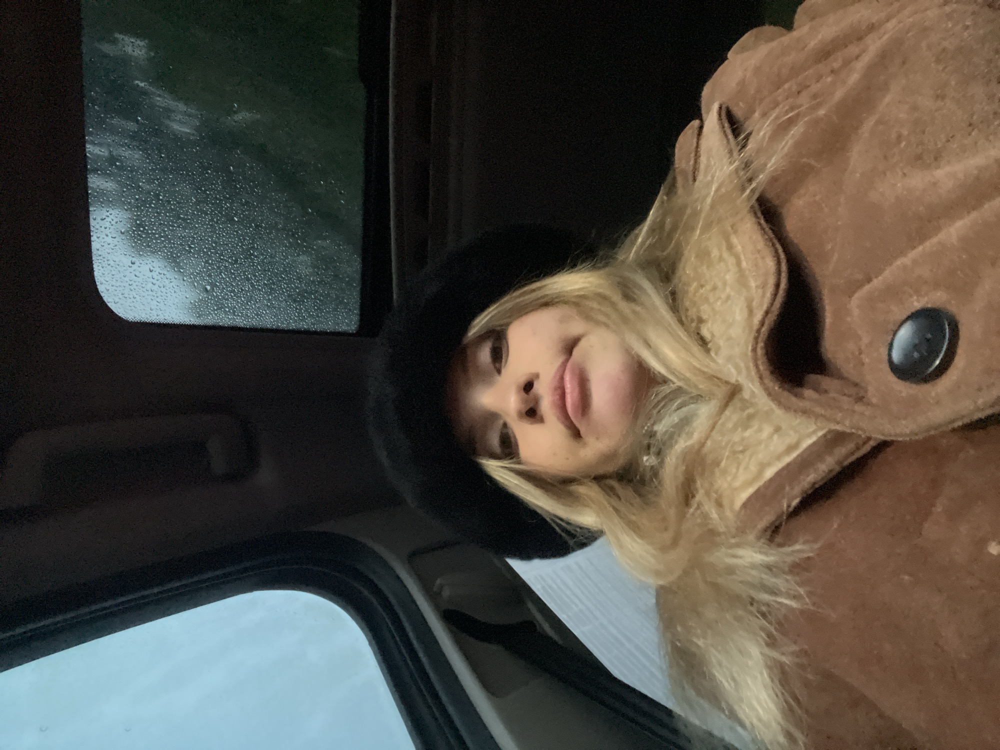 Woman in car during rainfall in Catamarca, Argentina