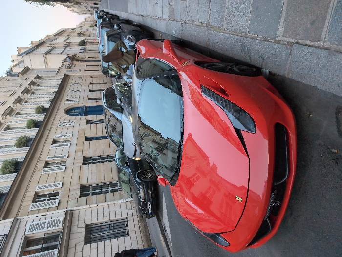 Red Ferrari spotted parked on Paris street