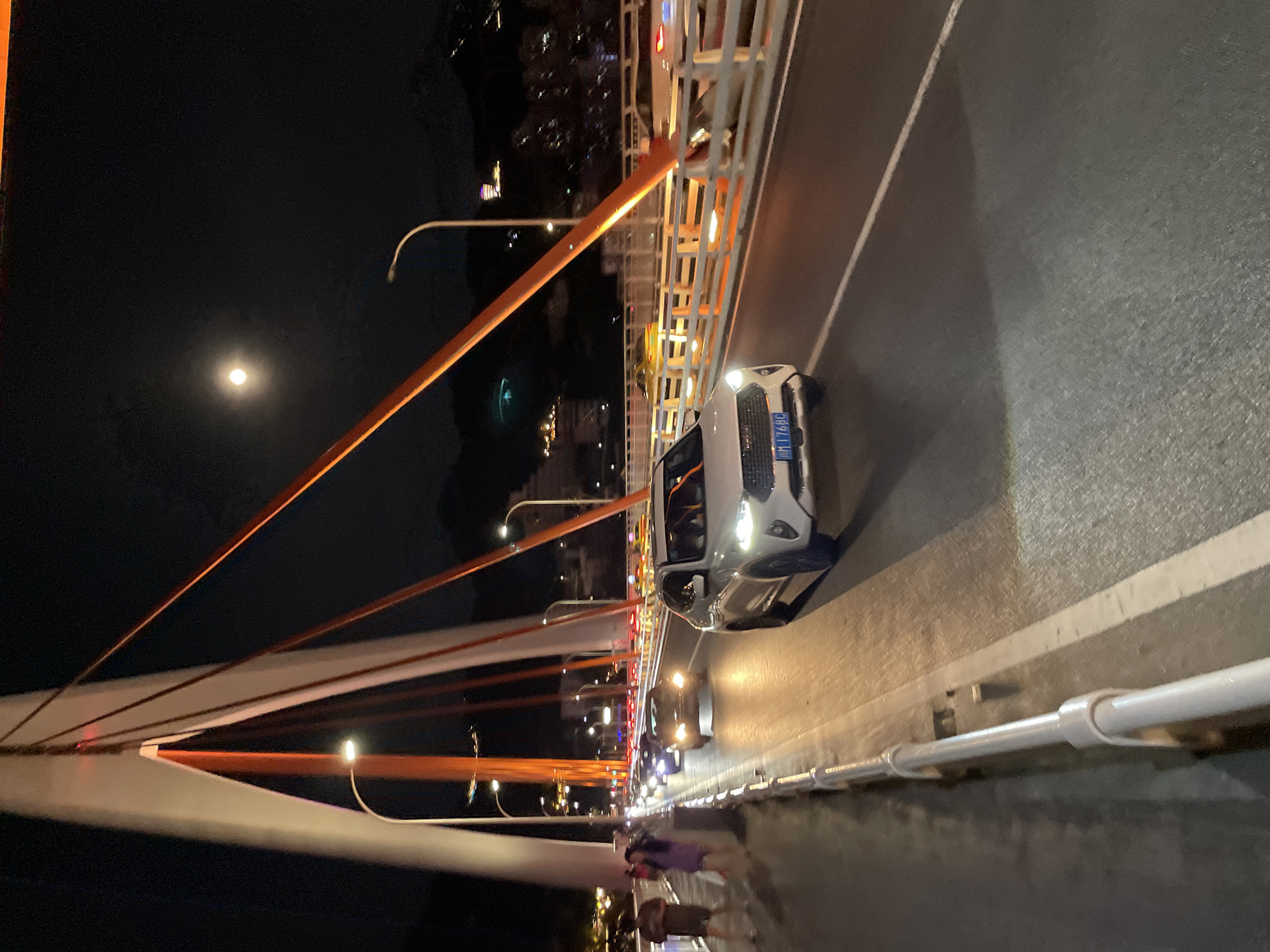 Night drive across Chongqing's river bridges, city lights in full glow