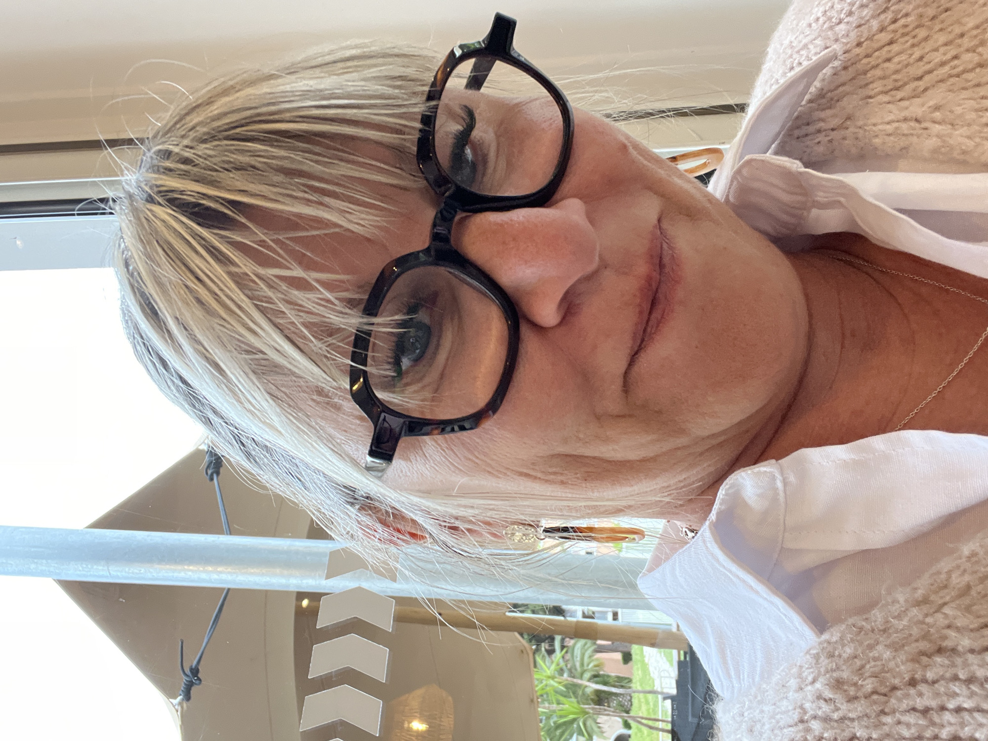 Woman enjoys breakfast in Grimaud, France morning