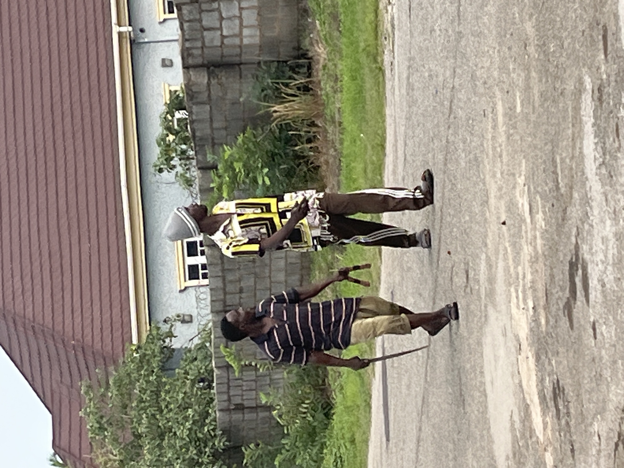 Morning street life on a residential road in Abuja
