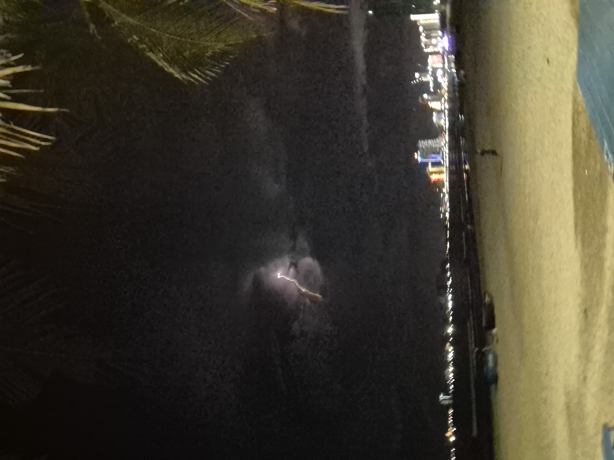 Night out on Đà Nẵng beach: beanbags, coconuts, and a storm offshore