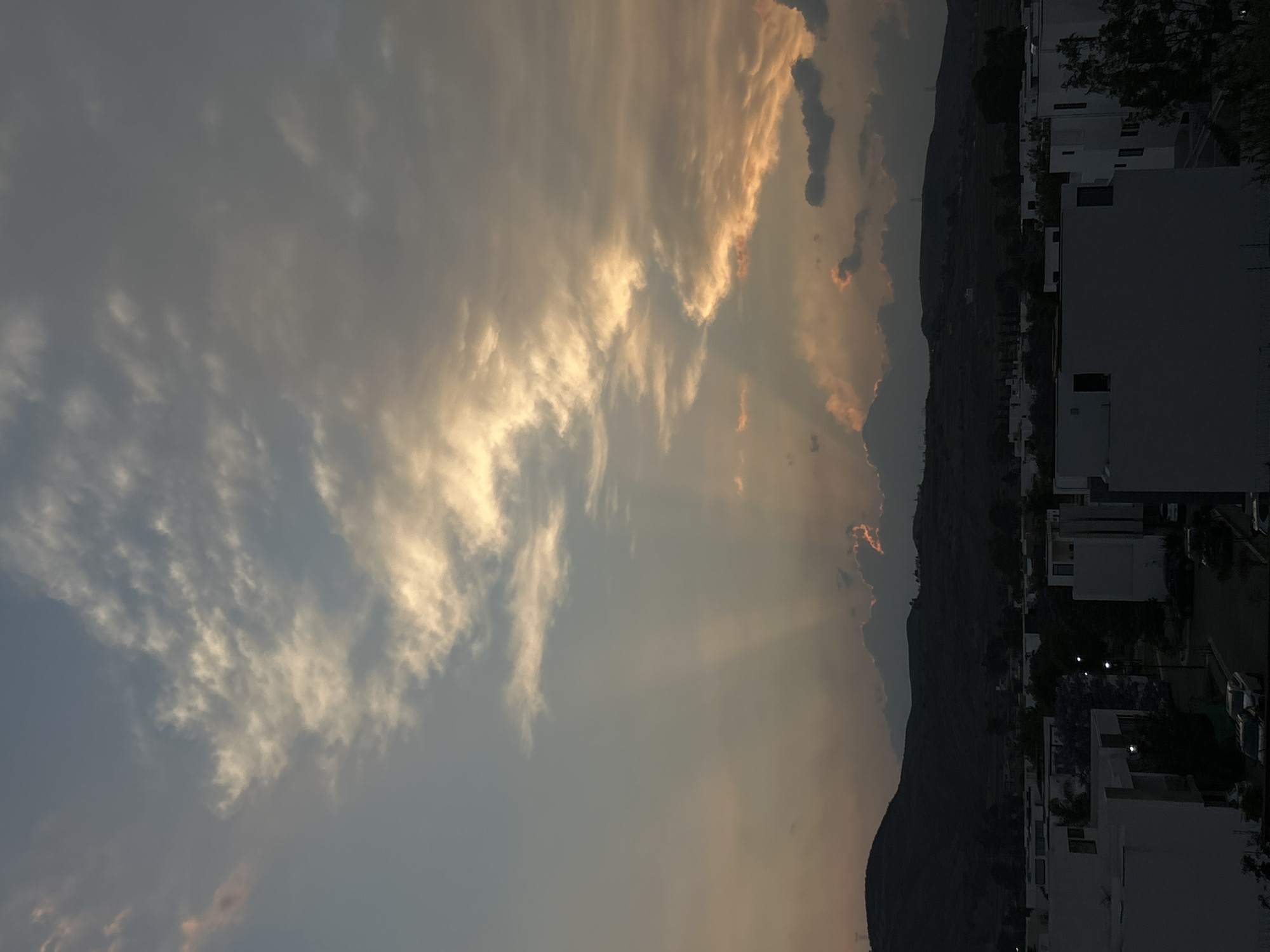 Dramatic sunbeams pierce clouds over Santa Clara Ocoyucan, Mexico