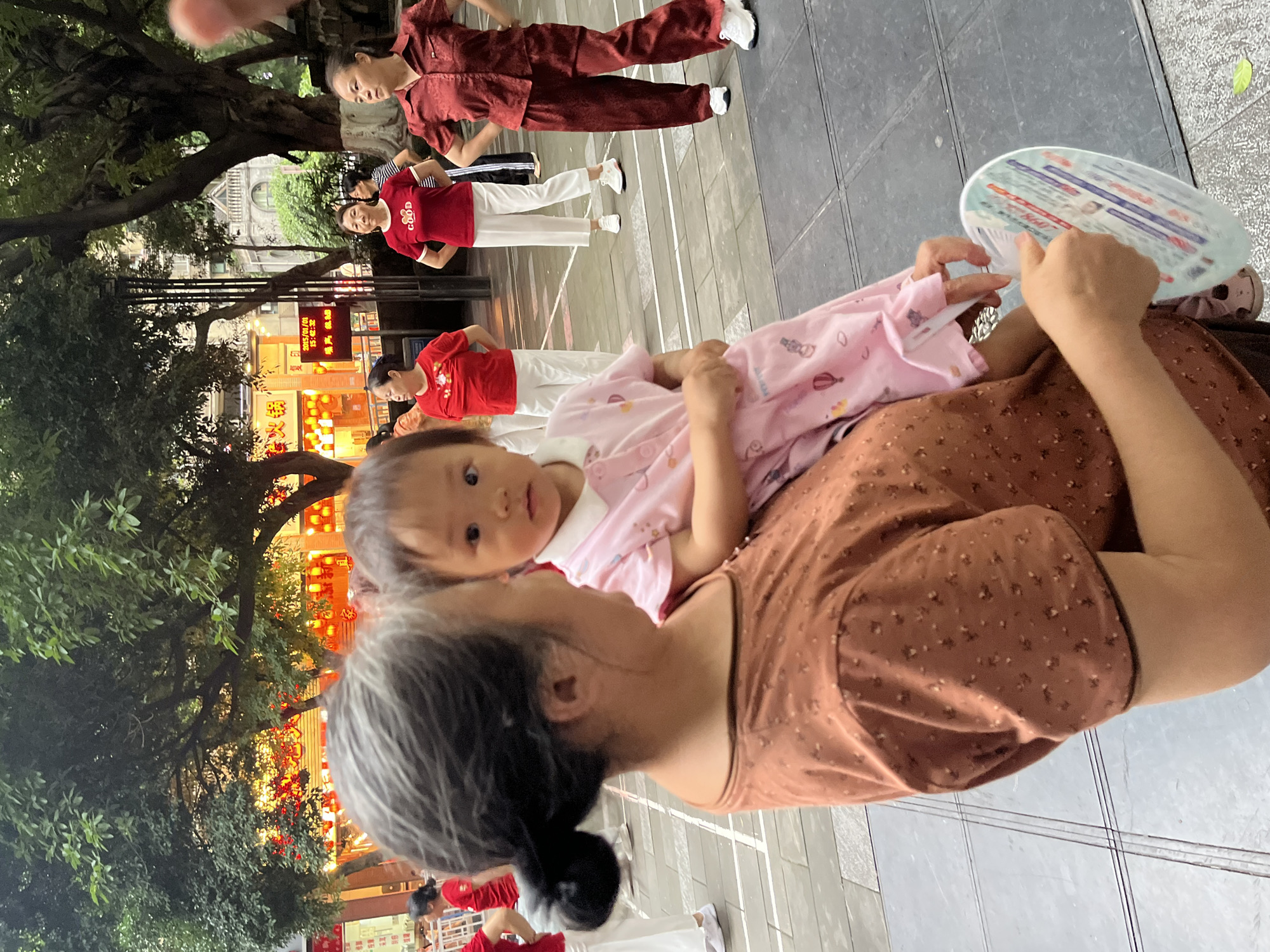 Everyday life in a Chongqing plaza, from dancers to delivery riders