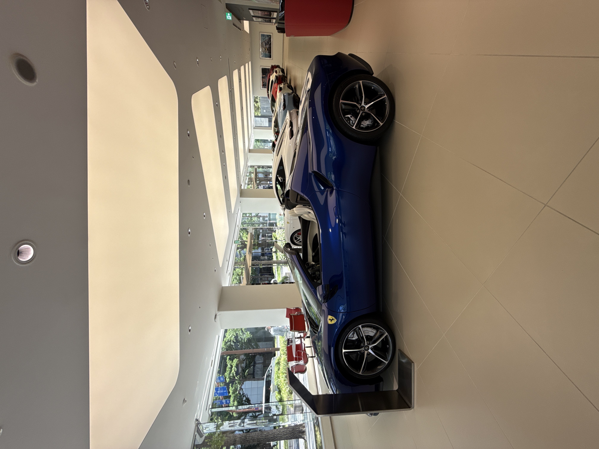 Ferrari dealership showcases luxury sports cars in Osaka showroom