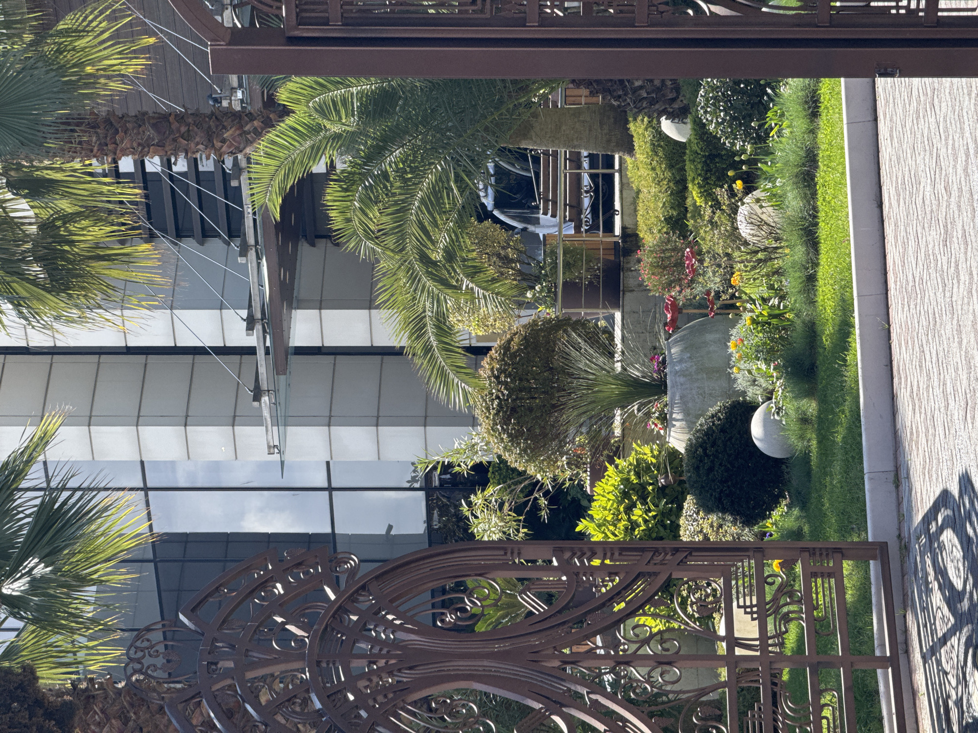Garden and modern glass building documented in Sirius, Russia
