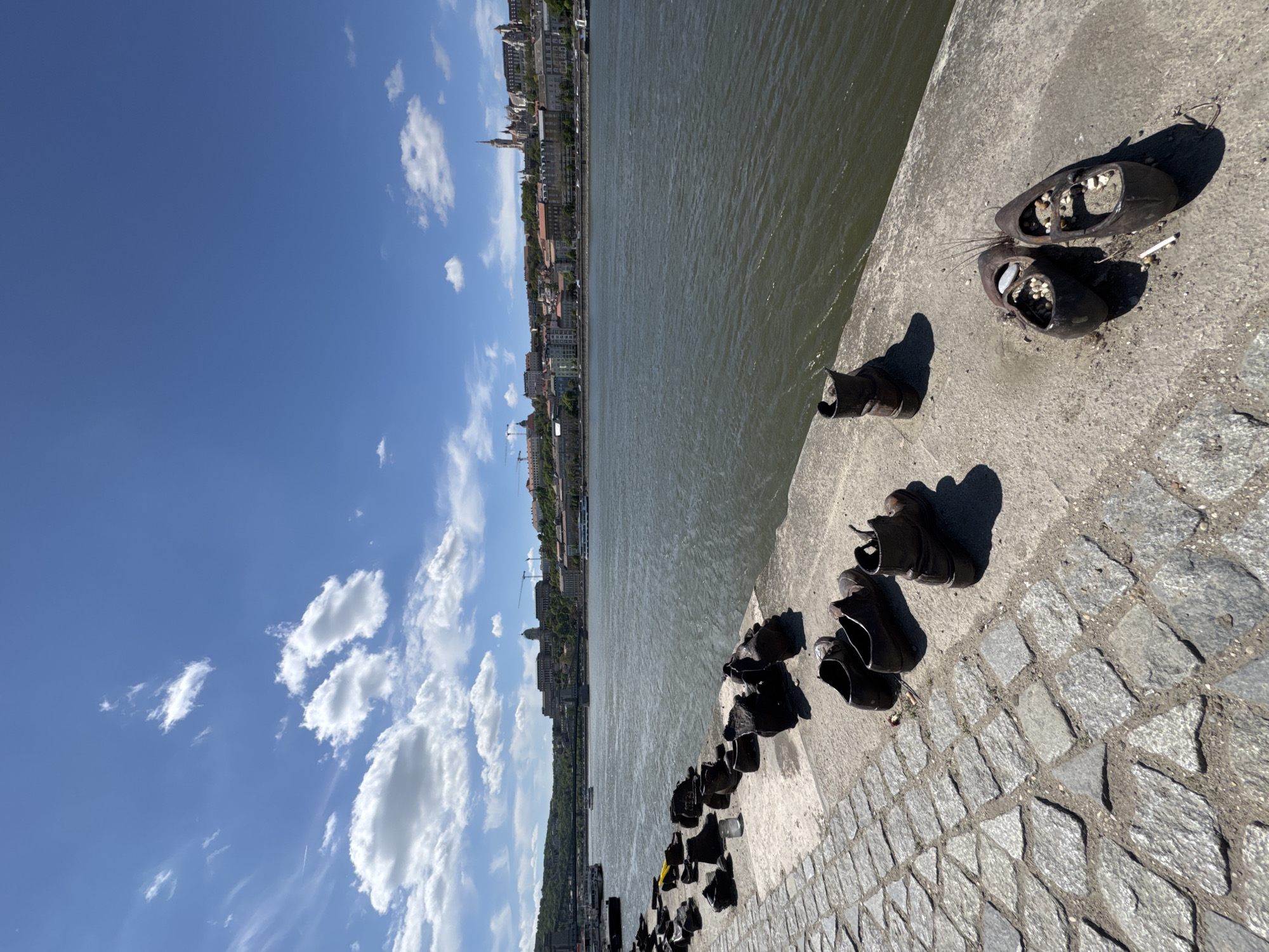 Visitors document Holocaust memorial along Budapest's Danube riverbank