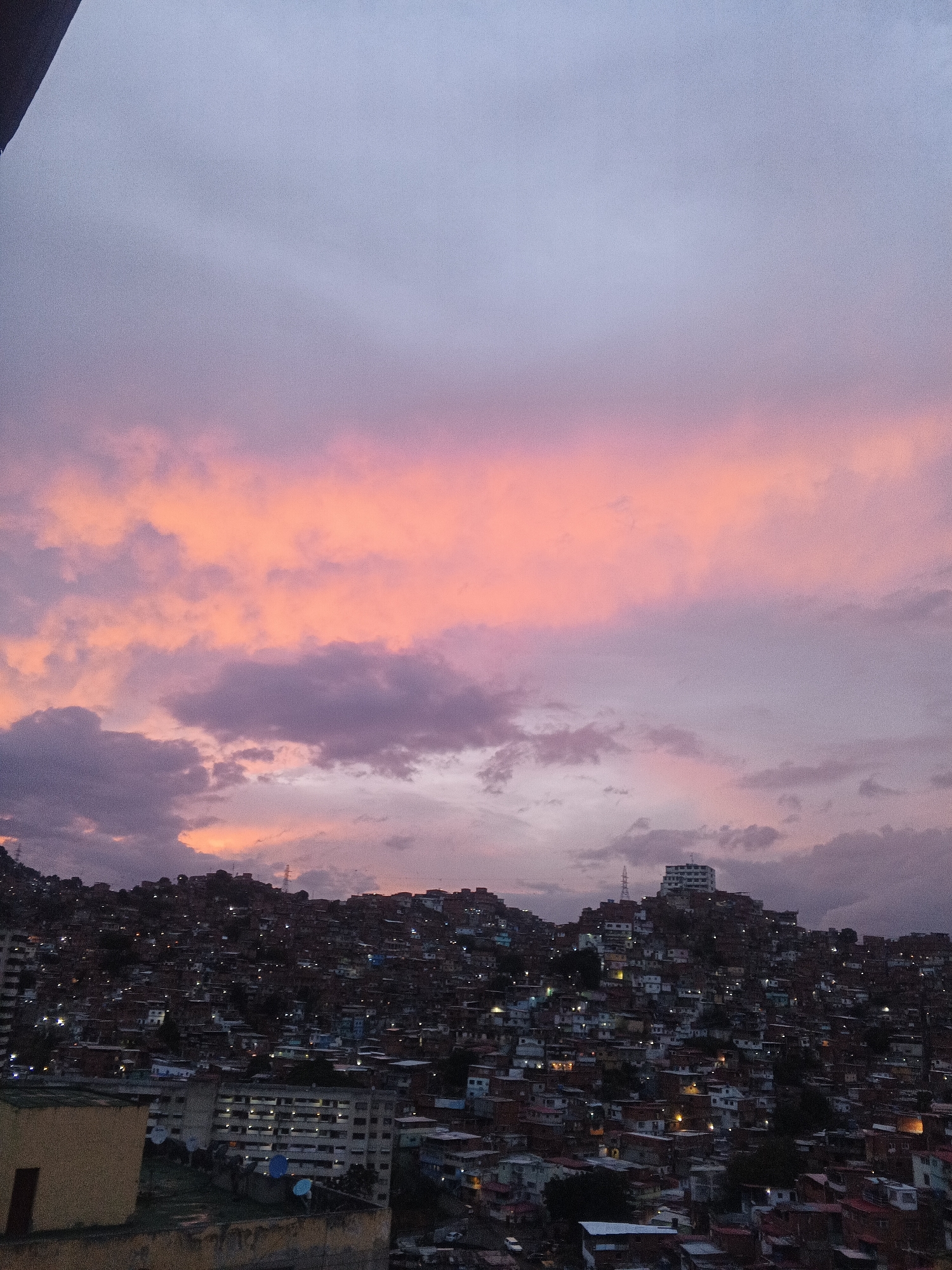 Evening twilight documented over Caracas hillside settlements