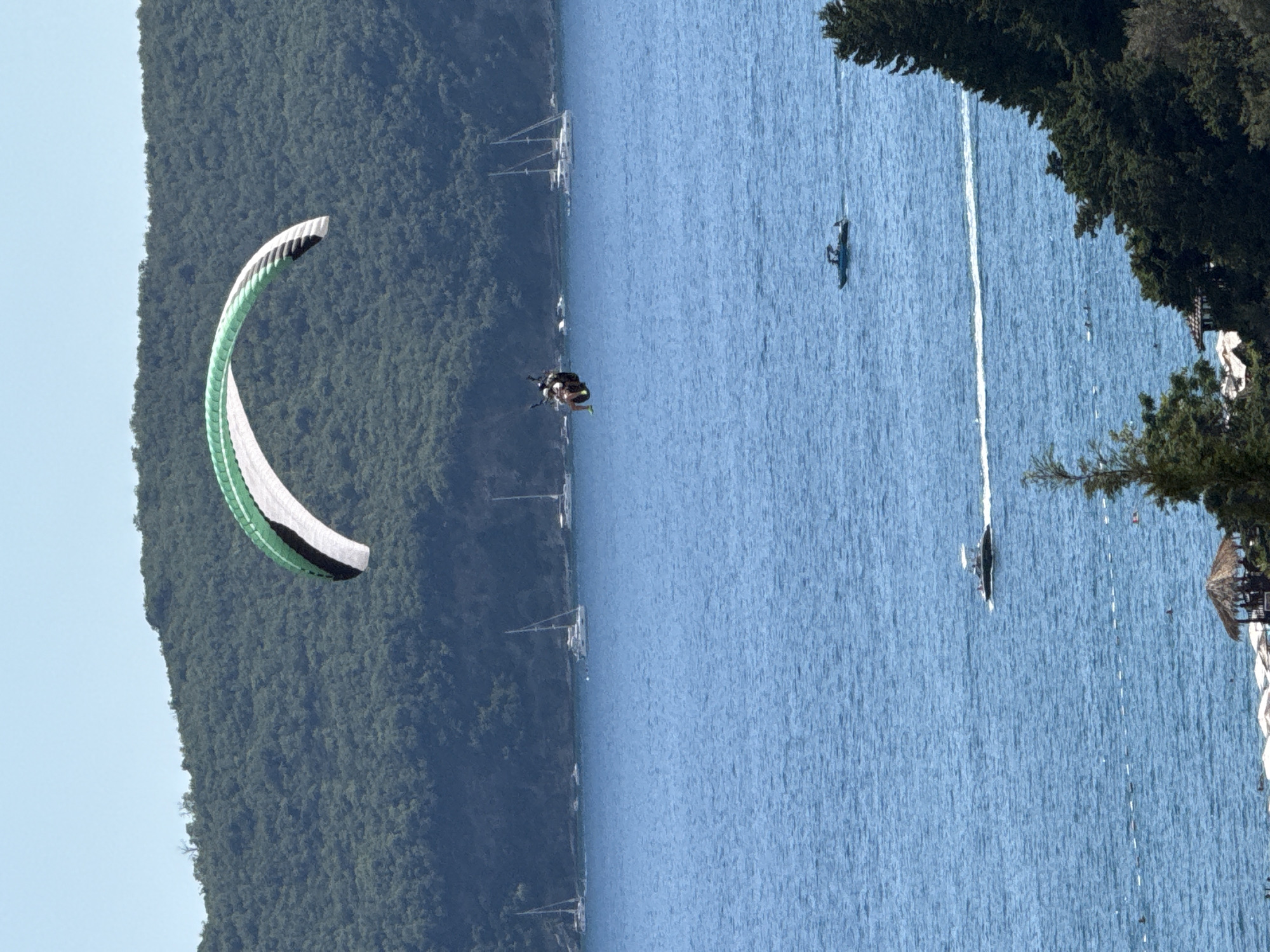 Paragliders ride thermals above the Adriatic coast at Boreti