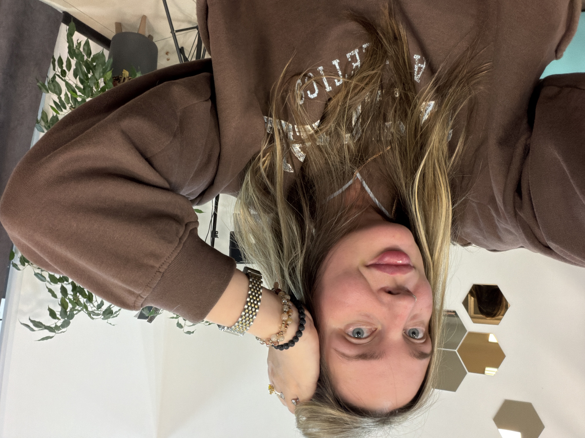 Woman takes mirror selfies at beauty salon in Chaikovsky