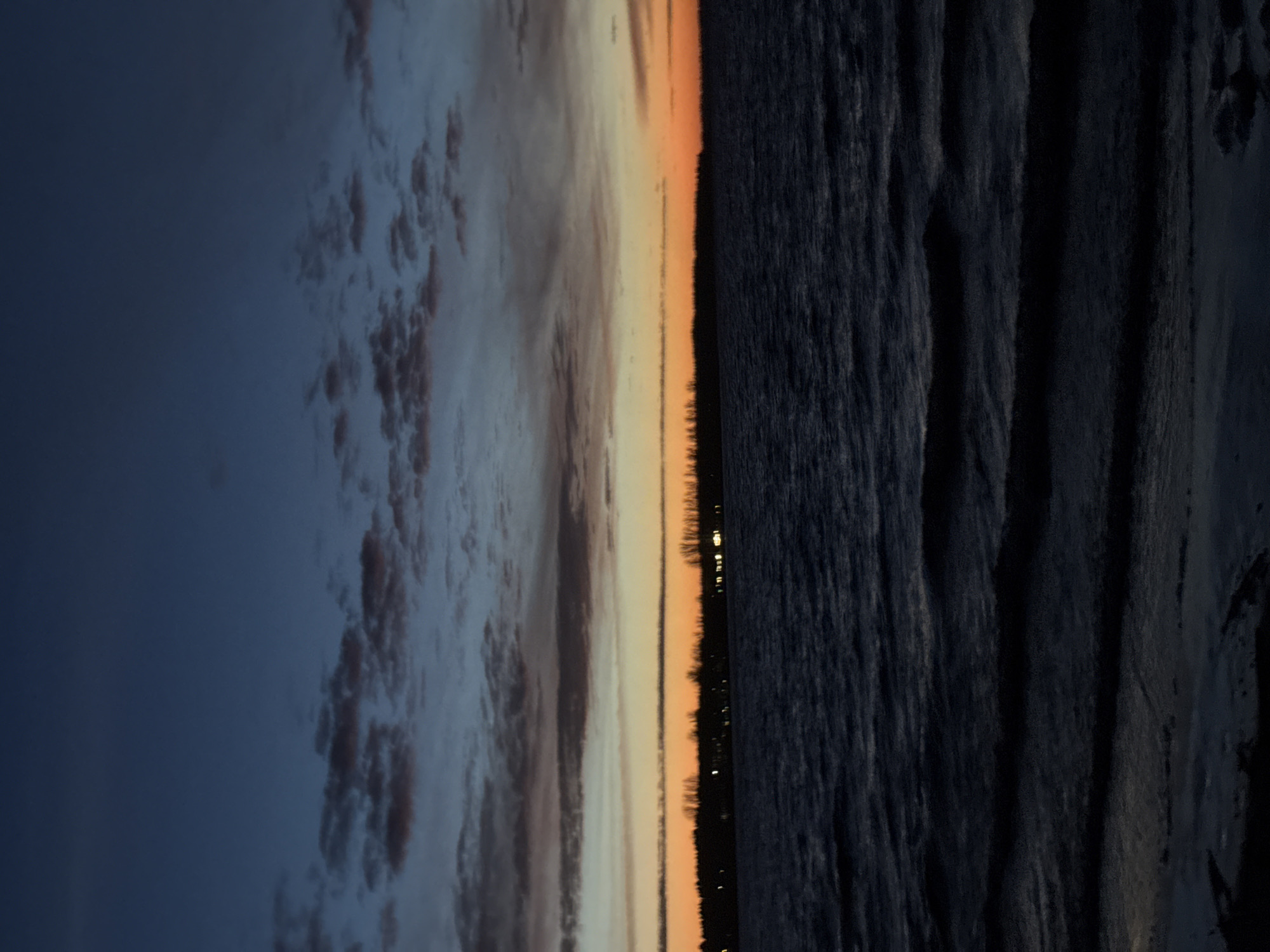 Sunset observed over water near Riga, Latvia